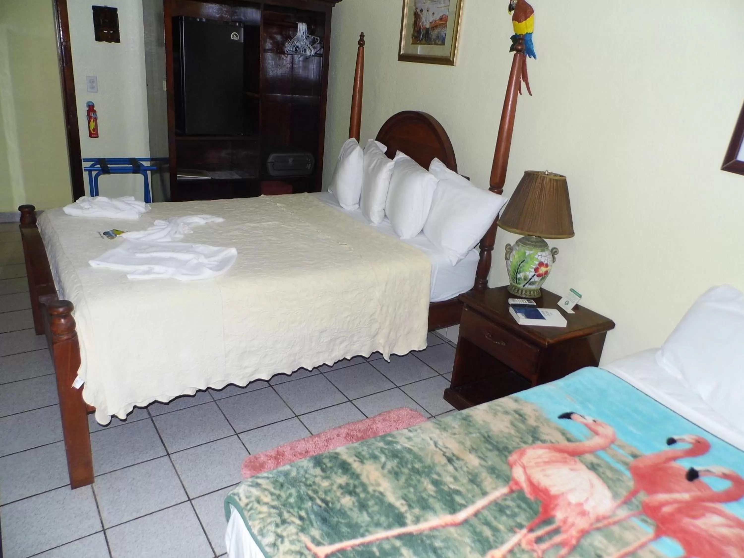 Bed in Alan's Paradise Hotel