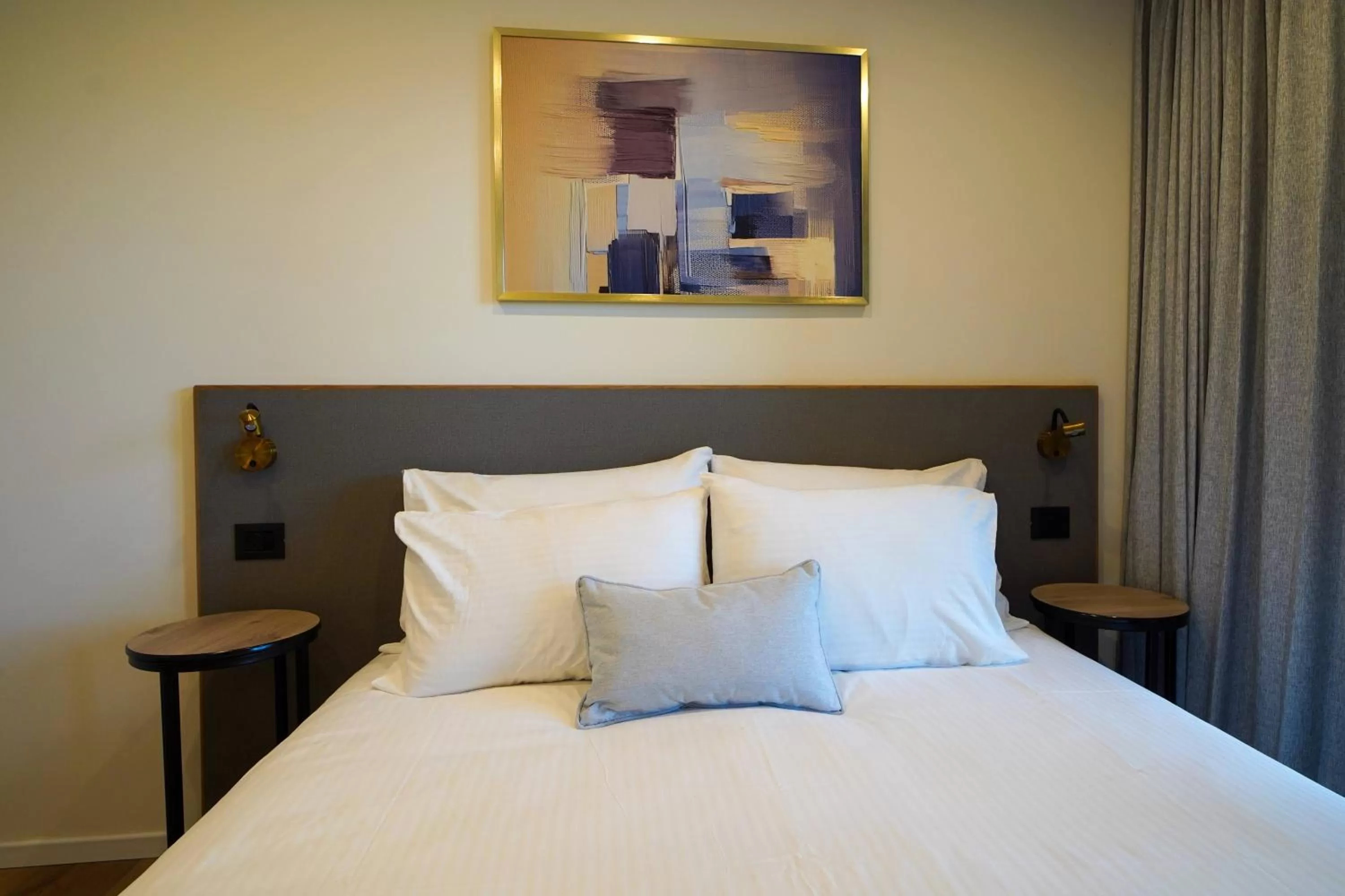 Bed in Urbanic Apartments