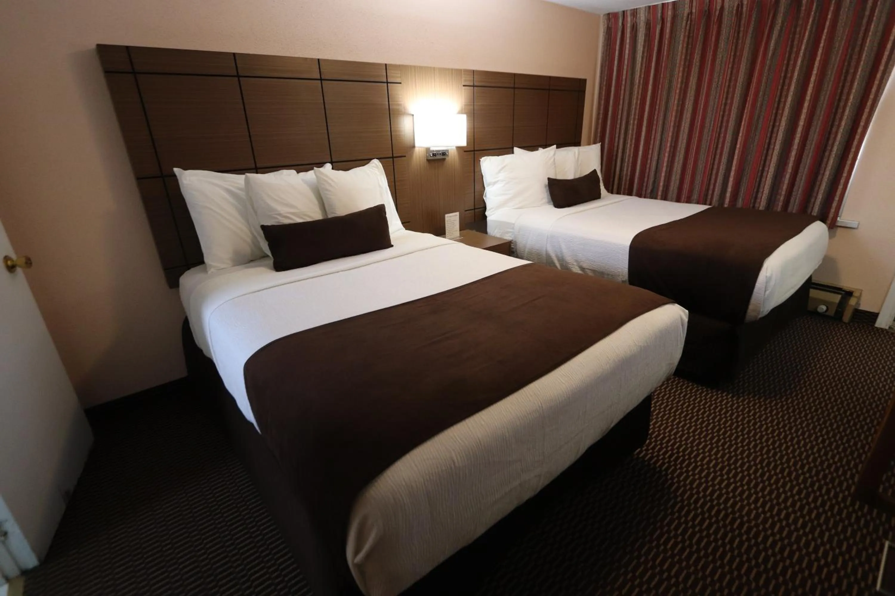 Bed in Campbellford River Inn