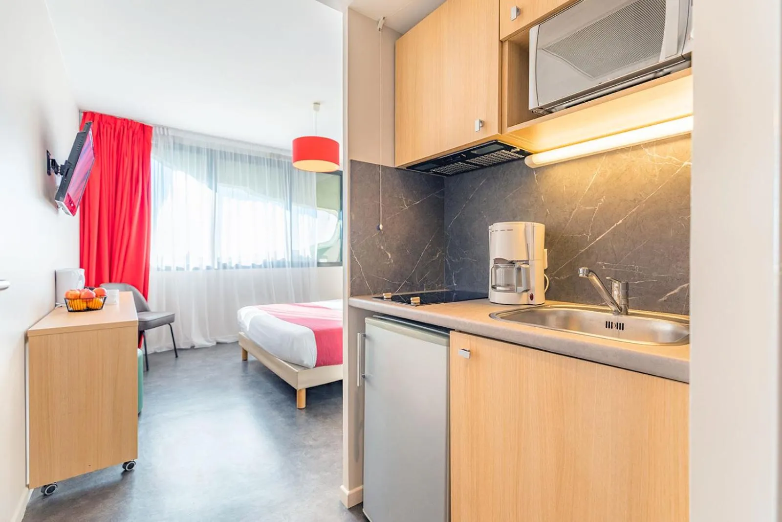 Kitchen or kitchenette, Bed in Appart’City Confort Montpellier Millénaire