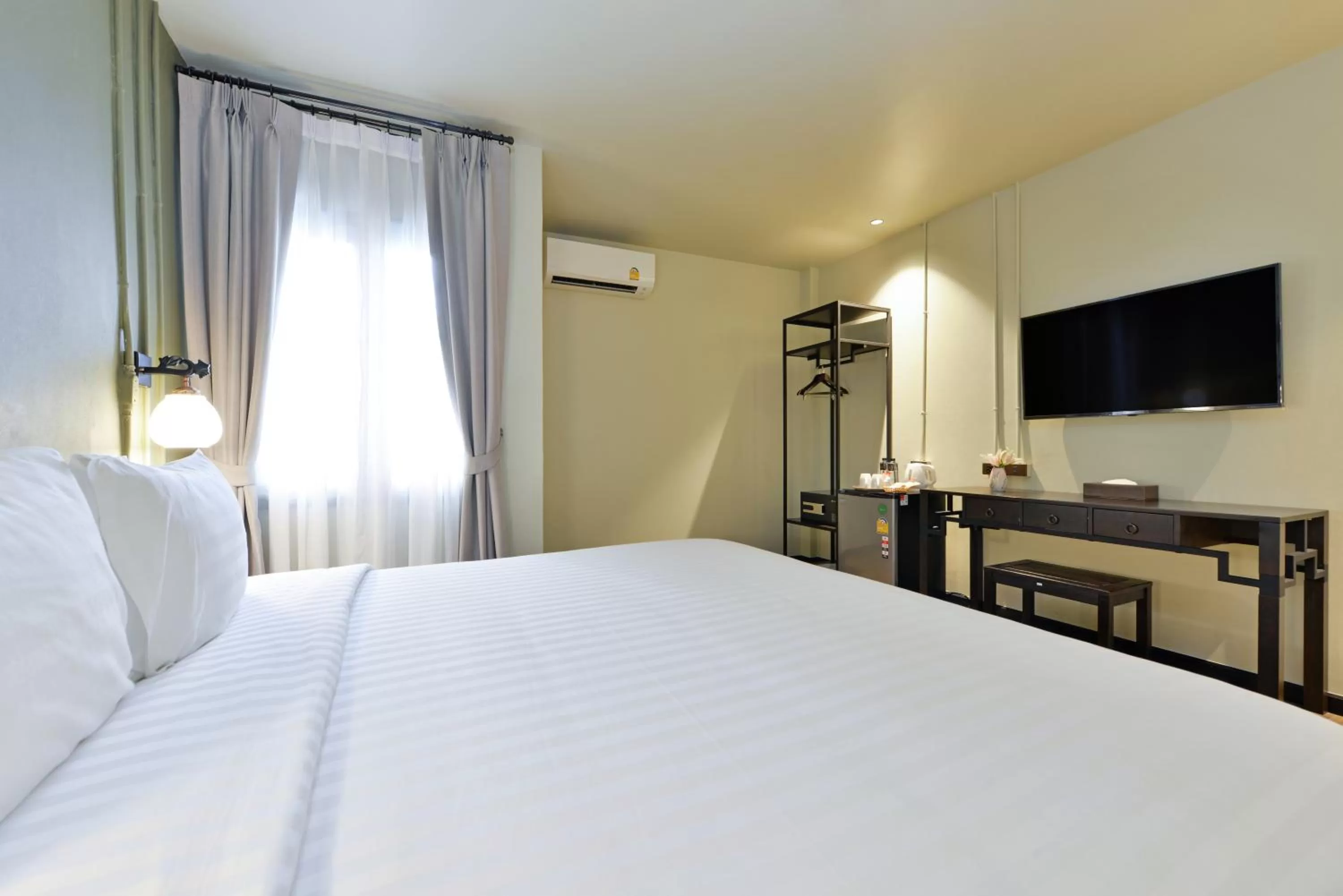 Bed in Oldthaiheng Hotel