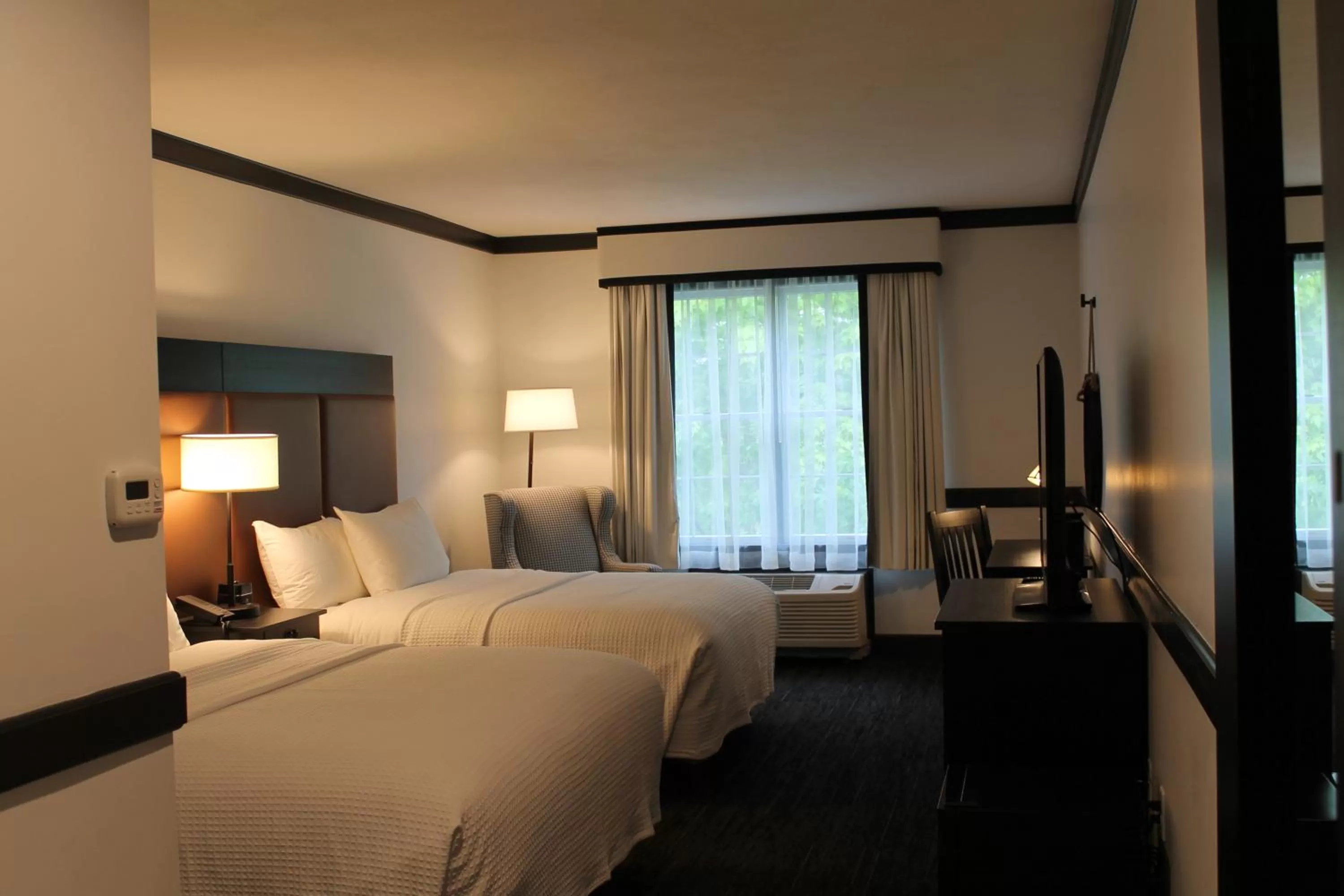 Bed in The Craftsman Inn & Suites