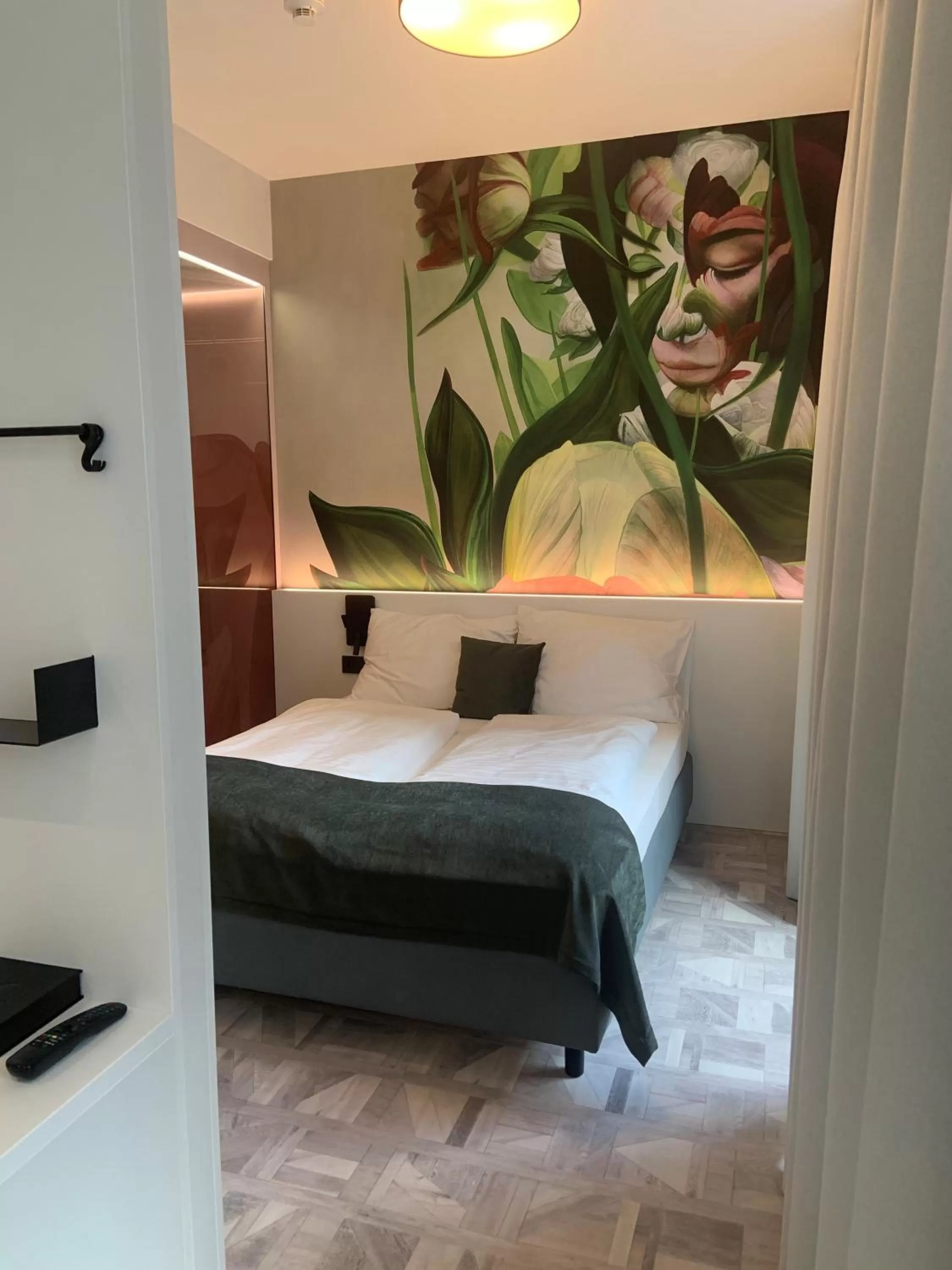 Bed in ART-INN Design Self-Check-in-Hotel