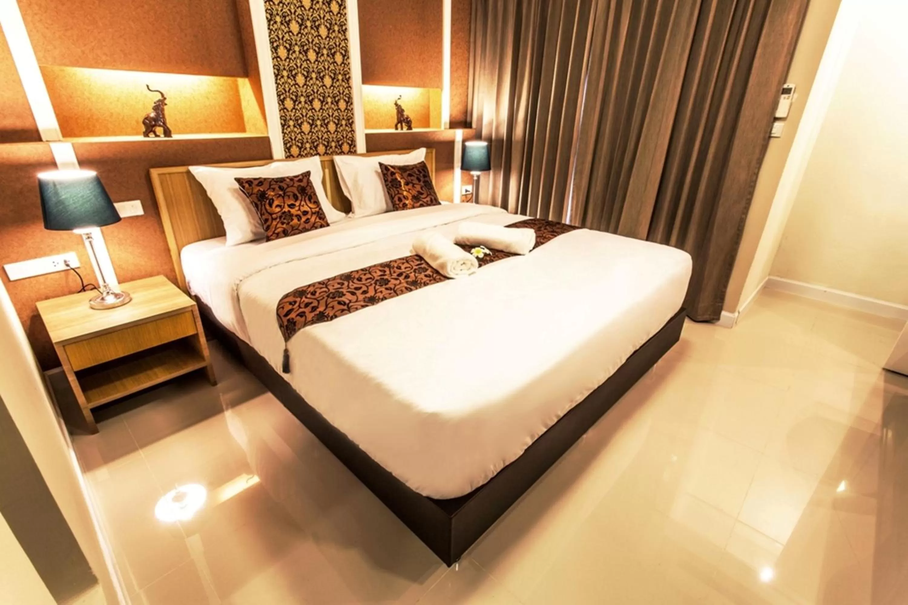 Photo of the whole room, Bed in The Aim Sathorn Hotel