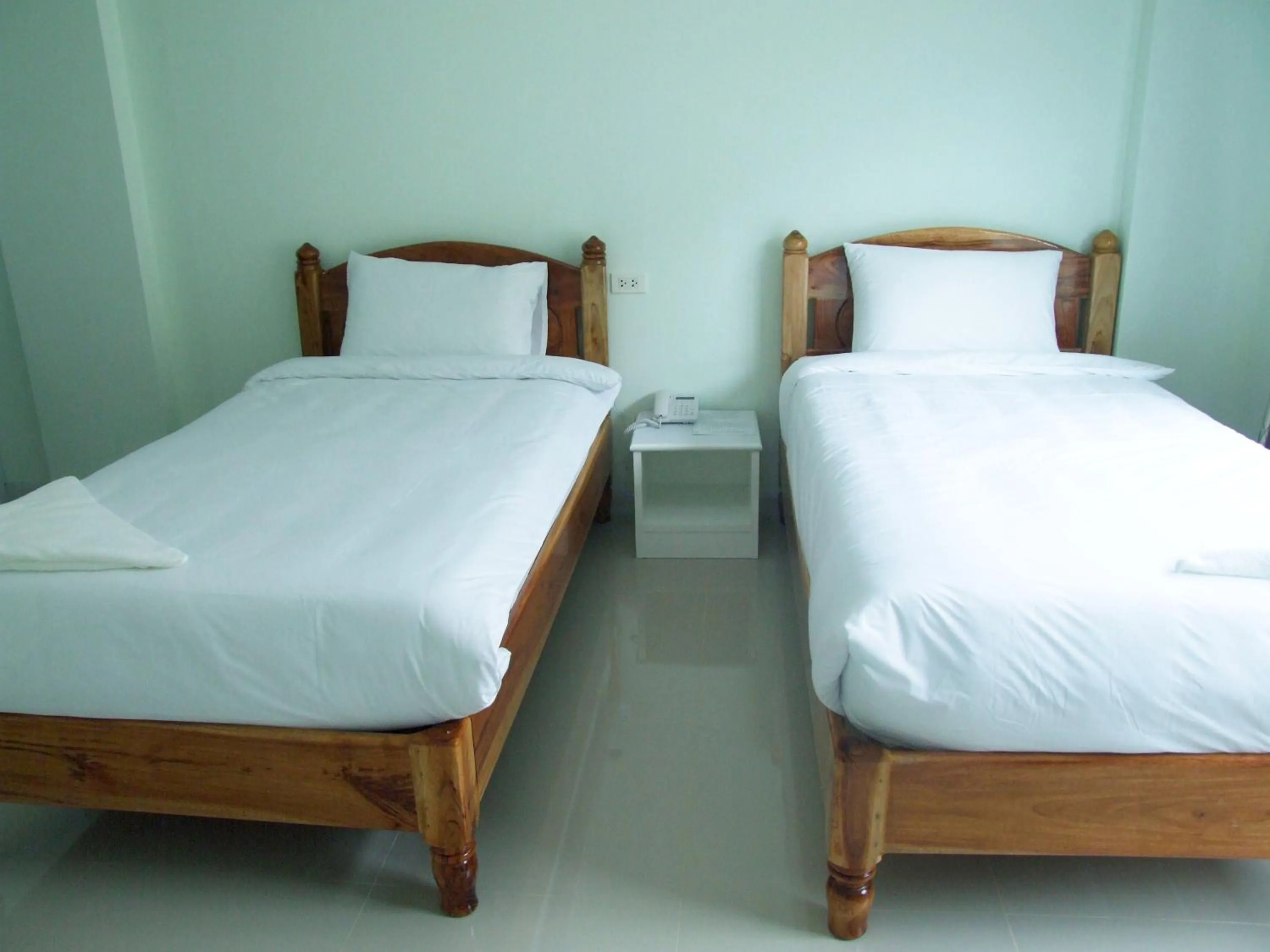 Bed in Rueanrimnam Hotel