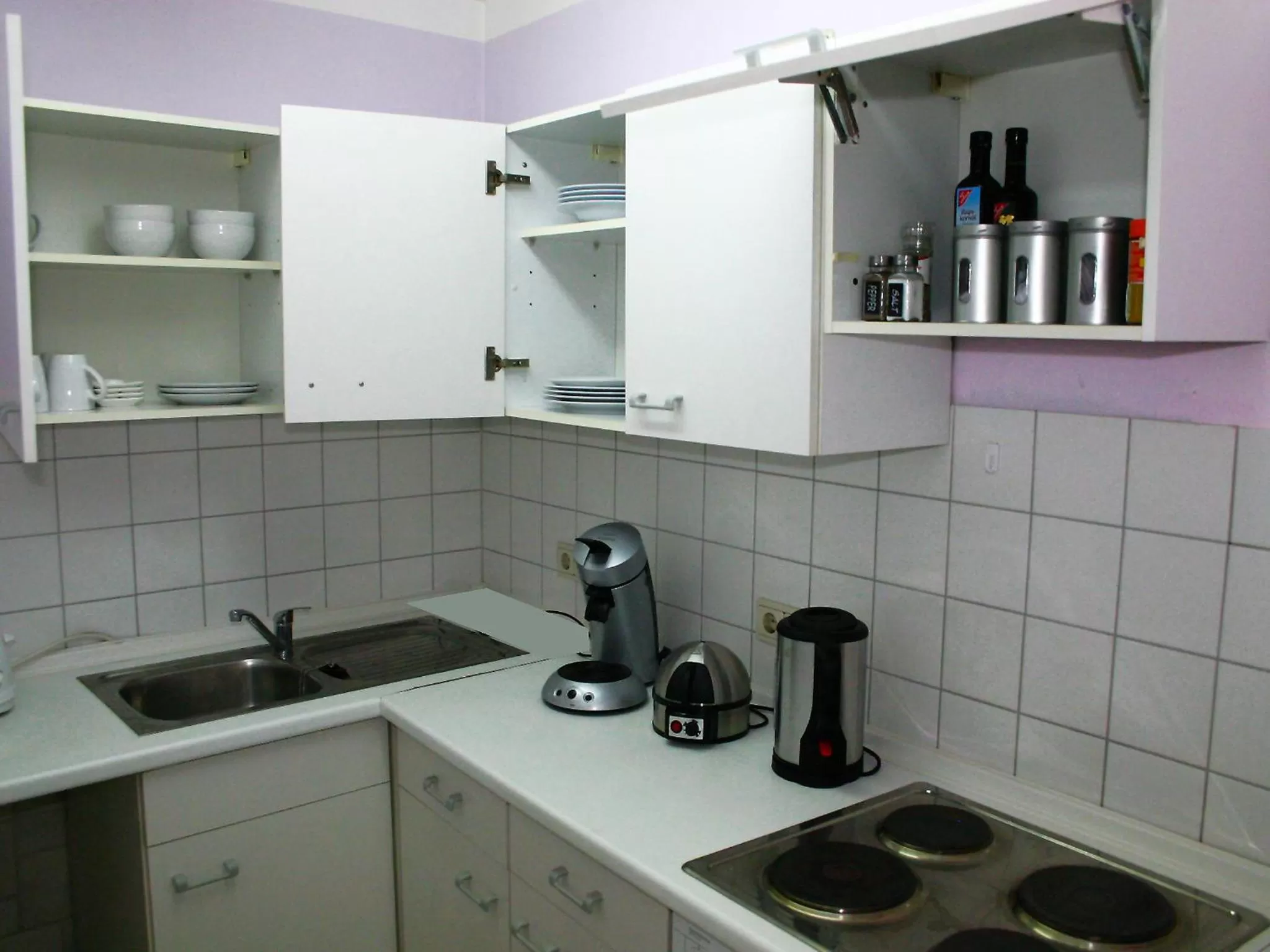Kitchen or kitchenette in Boutique Hotel Little Venezia