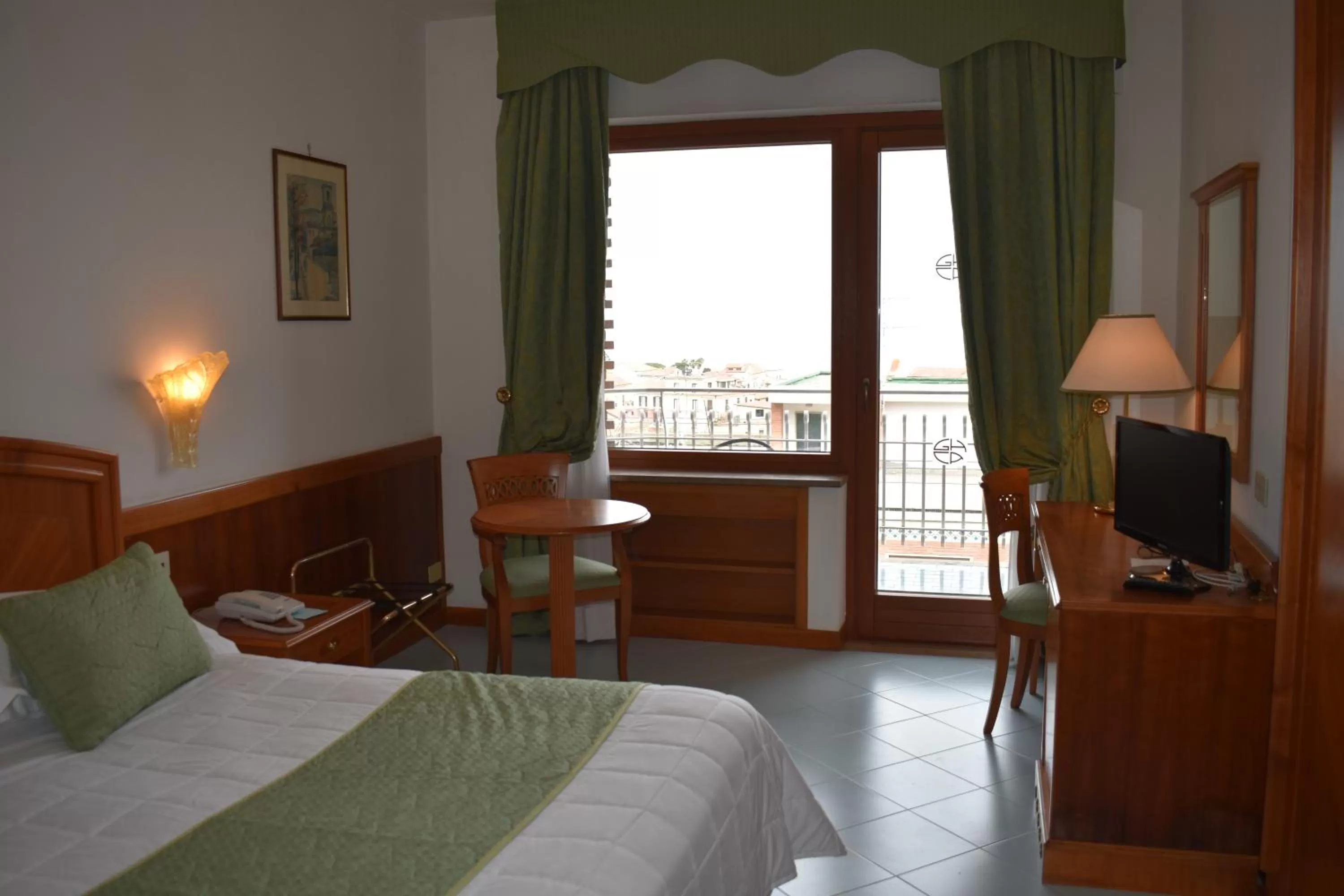 Bed in Grand Hotel Cesare Augusto