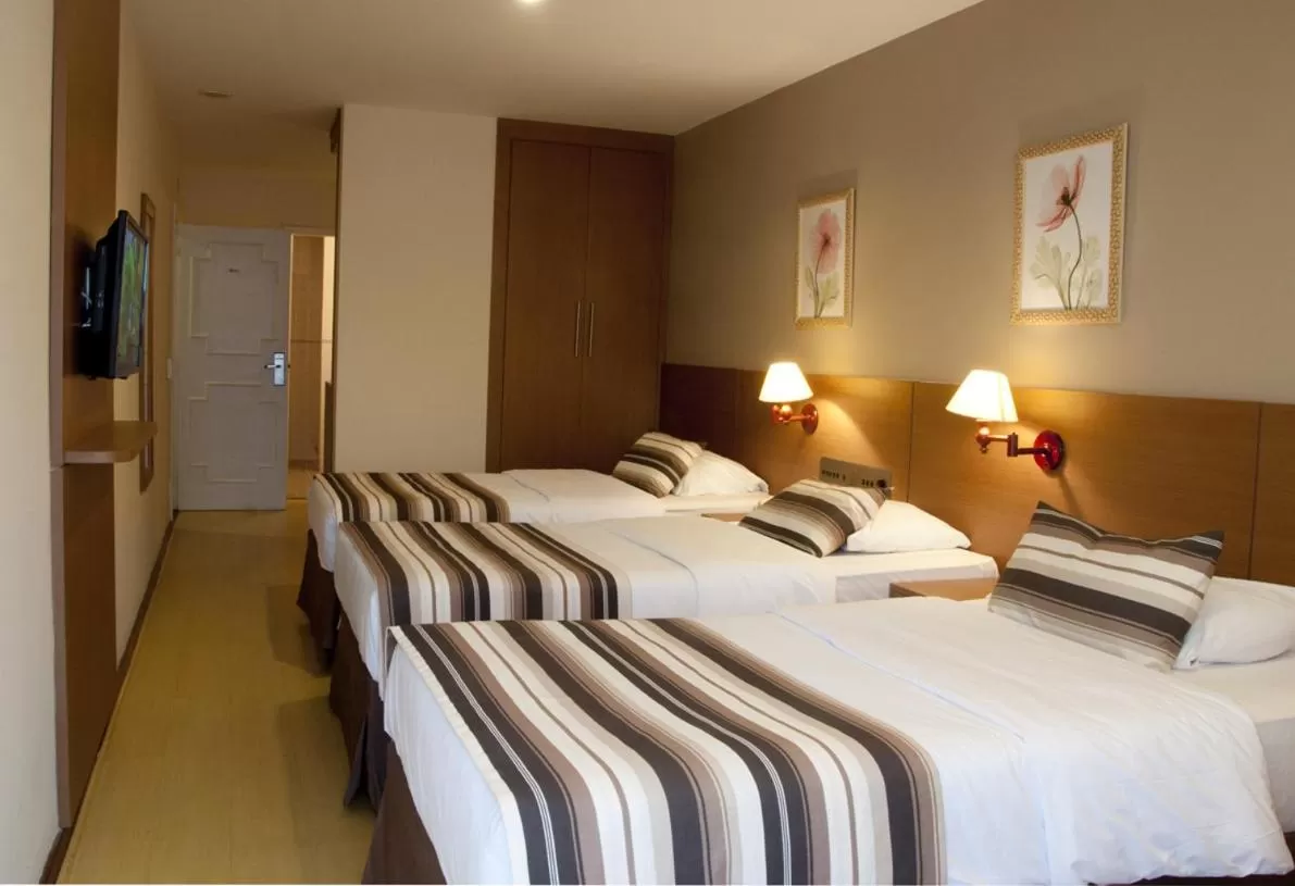 Bed in Augusto's Copacabana Hotel