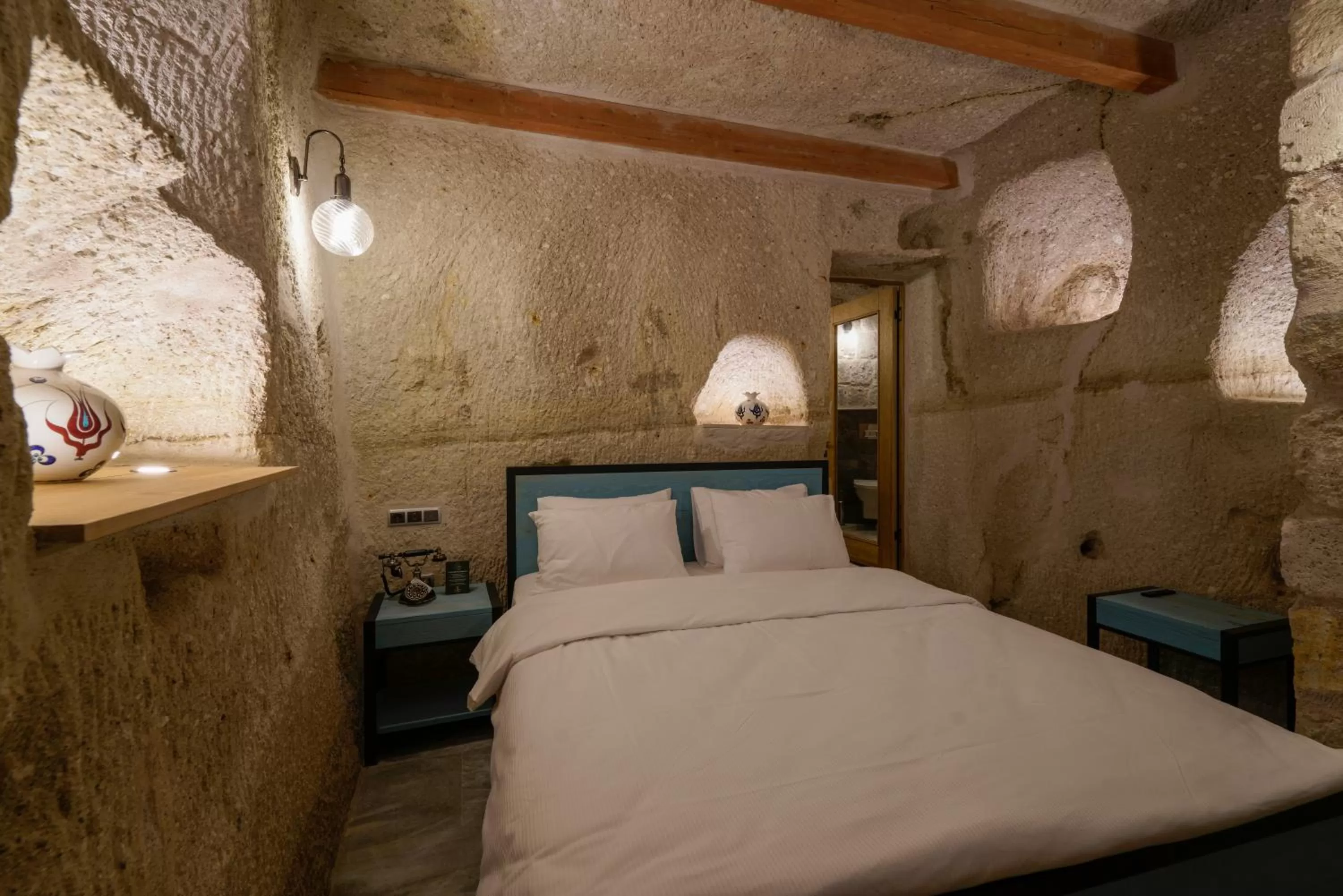 Bed in The Niche Cave Hotel
