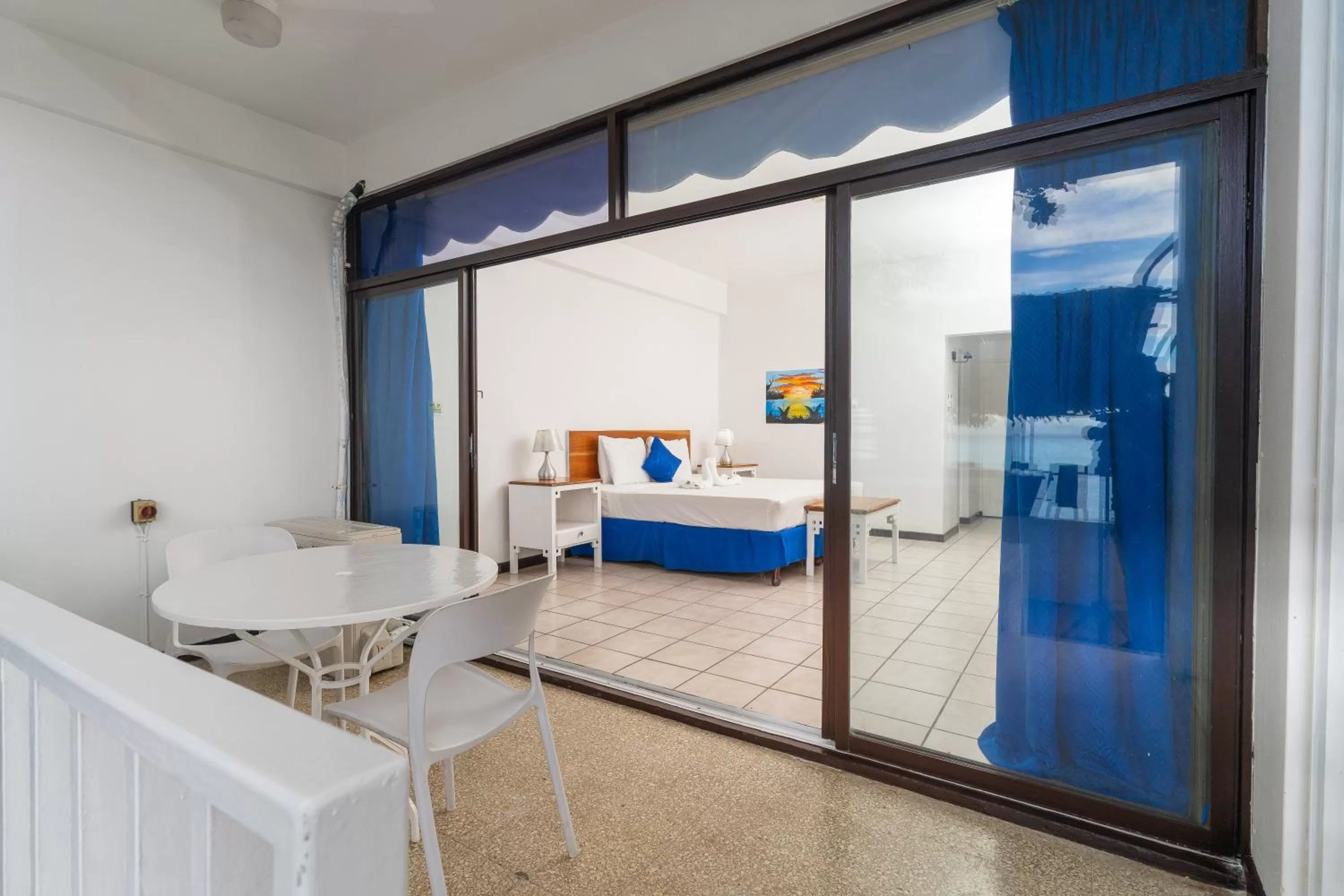 Bedroom, Bed in Sand and Tan Beach Hotel