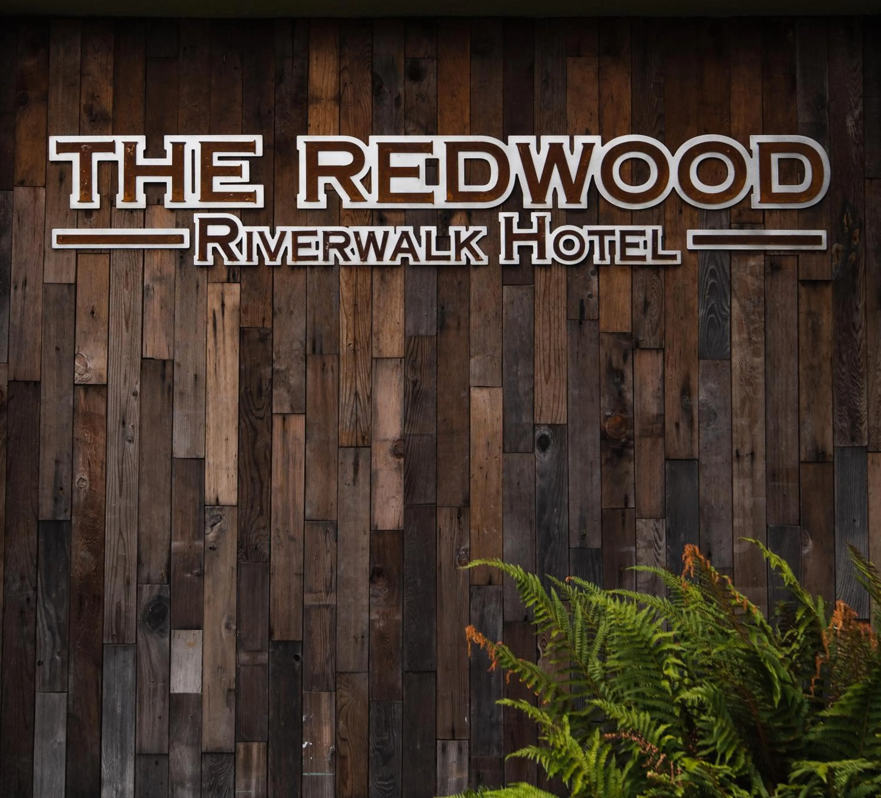 Property logo or sign in The Redwood Riverwalk, a boutique hotel