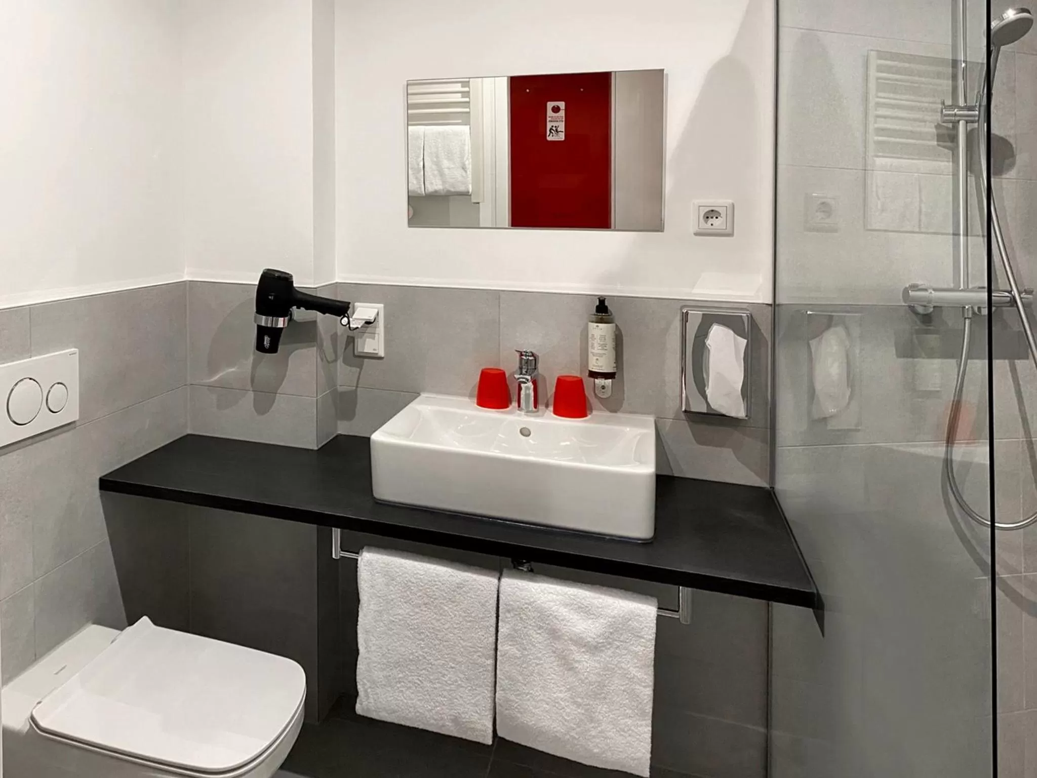 Bathroom in DORMERO Hotel Darmstadt