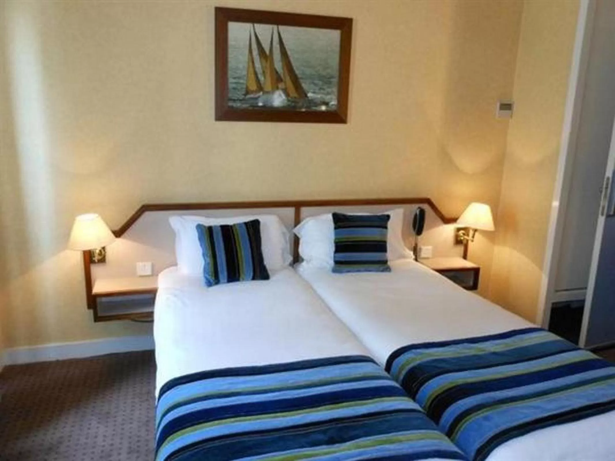 Bed in Hôtel Opera Deauville