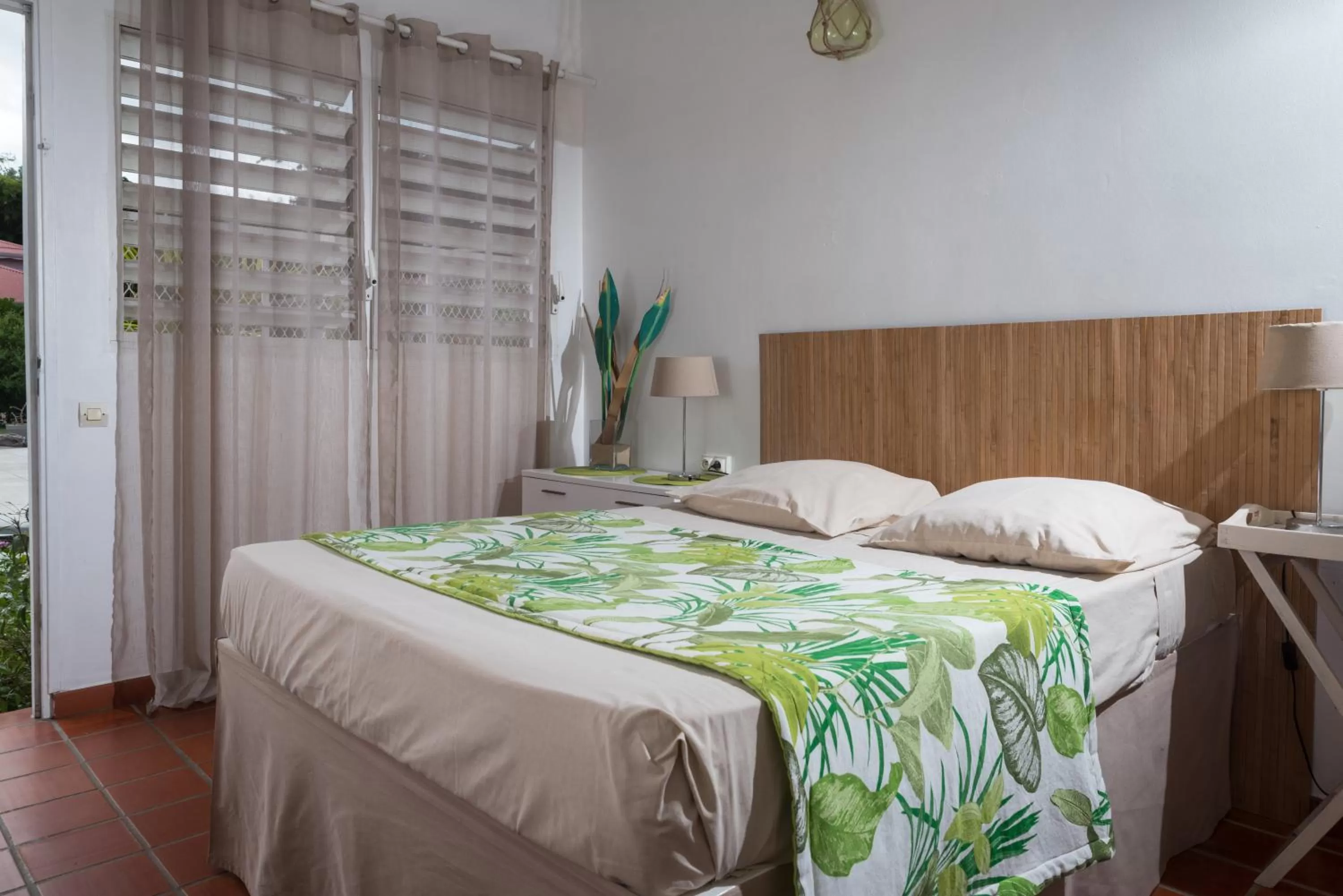 Photo of the whole room, Bed in Hôtel Les Bananiers