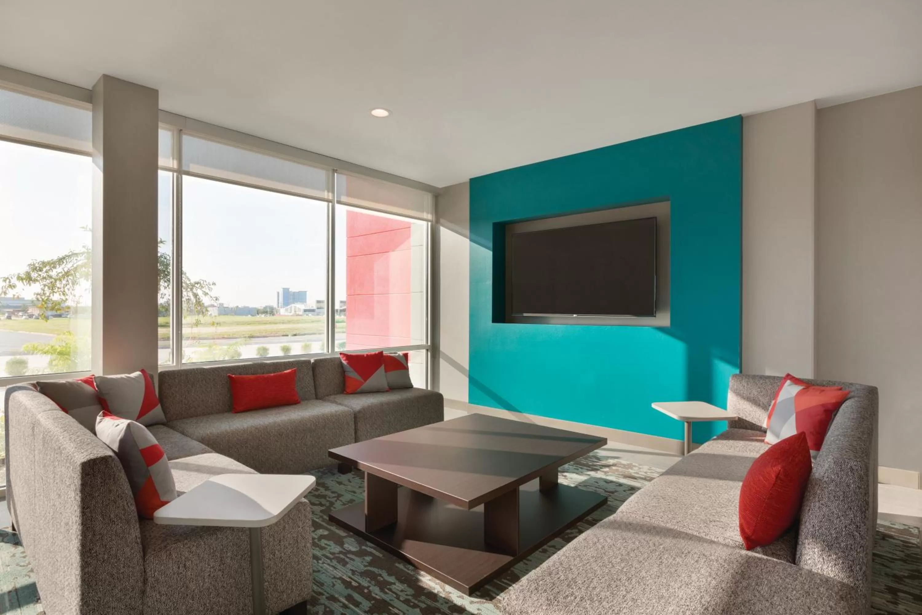 Communal lounge/ TV room in avid Hotel - Toronto - Vaughan Southwest by IHG