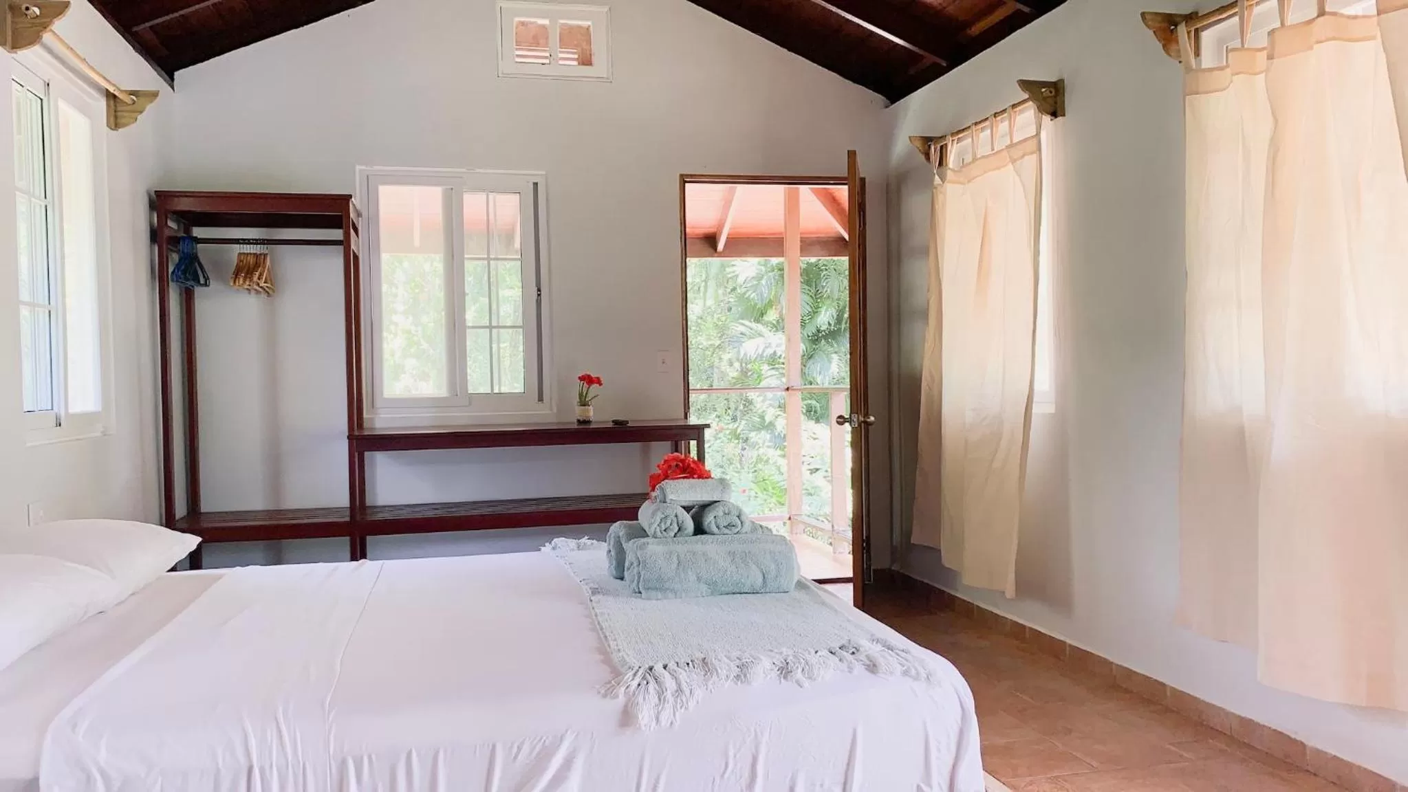 Bed in Bird Island Bungalows