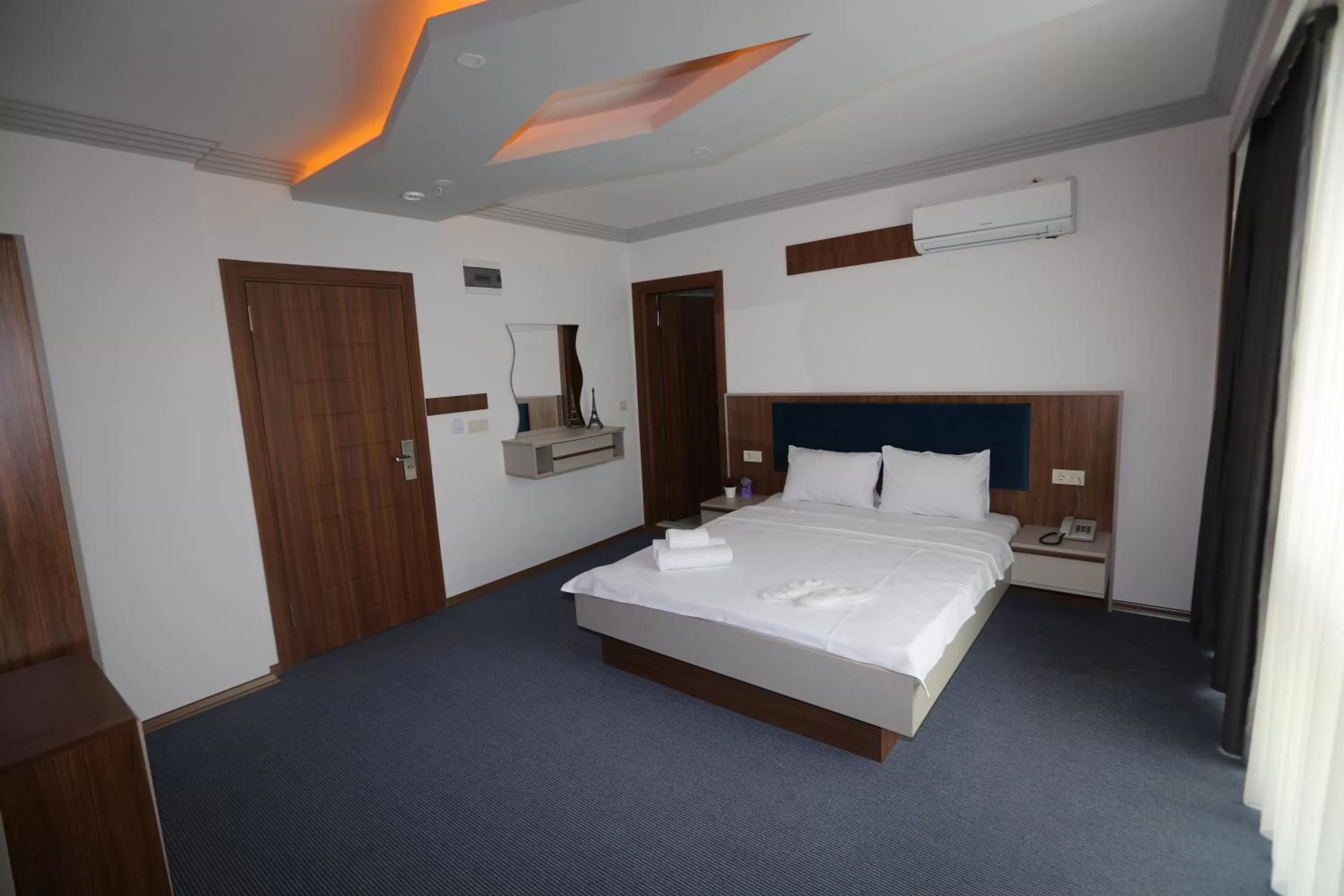 Bed in TEVETOGLU HOTEL