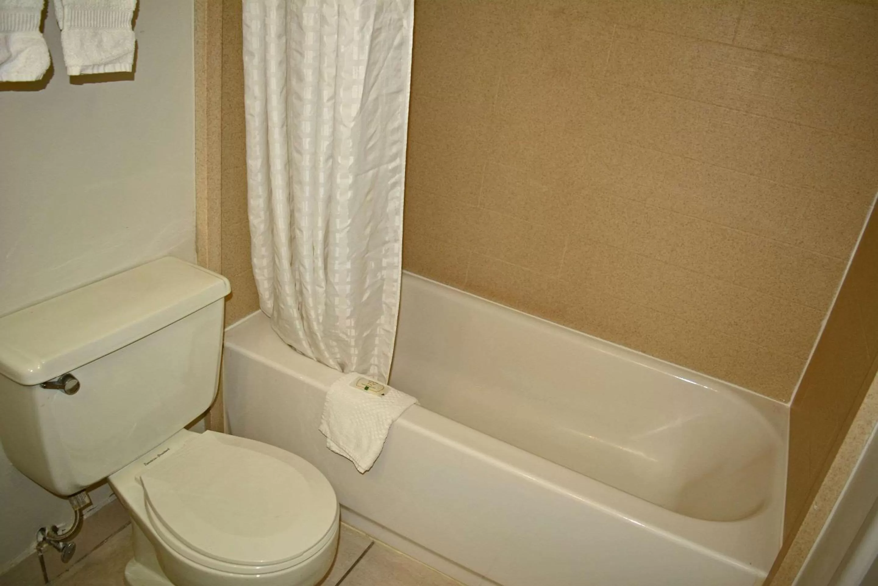 Bedroom in Quality Inn & Suites East Syracuse - Carrier Circle