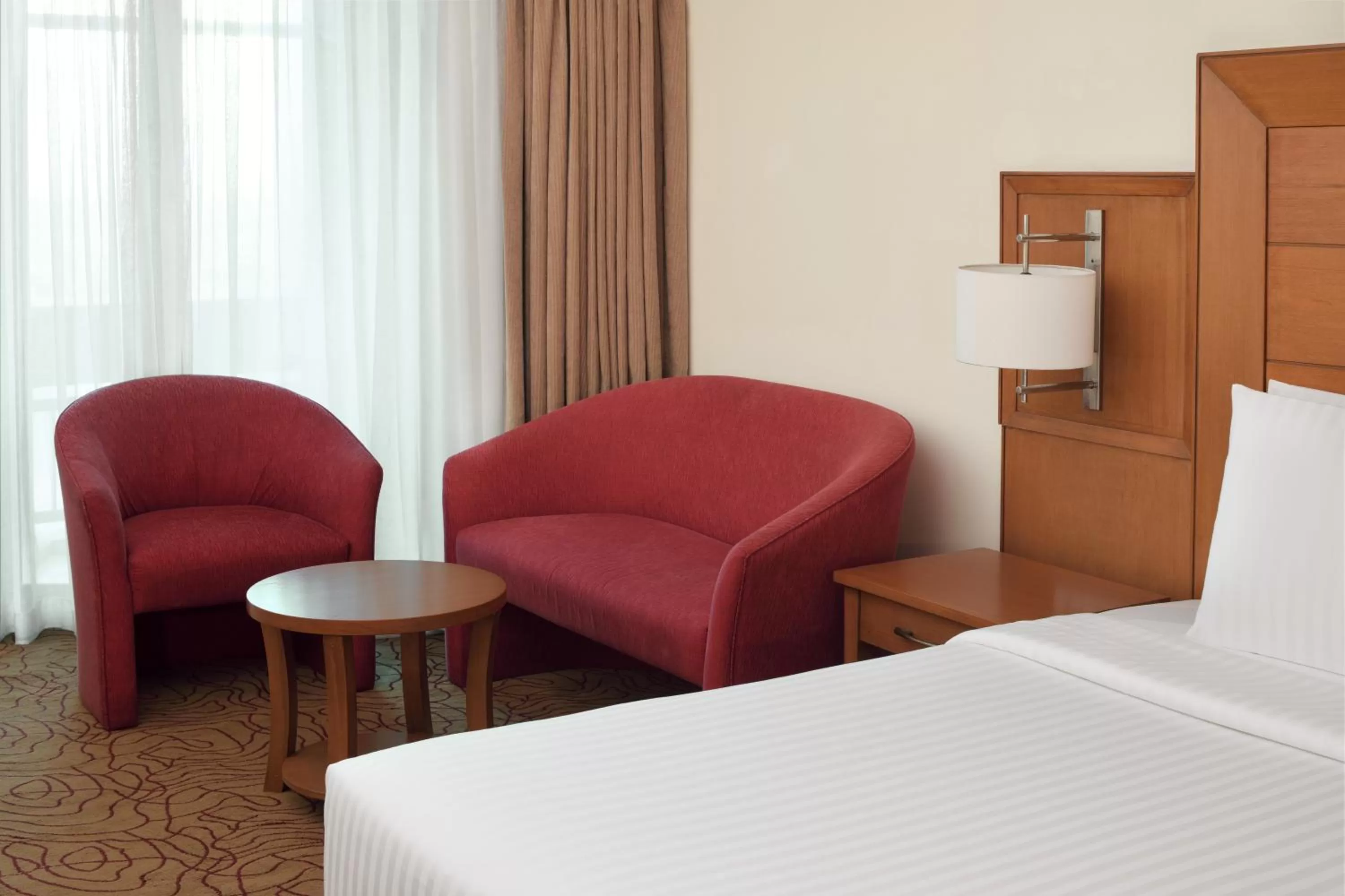 Seating area, Bed in Mövenpick Hotel Karachi