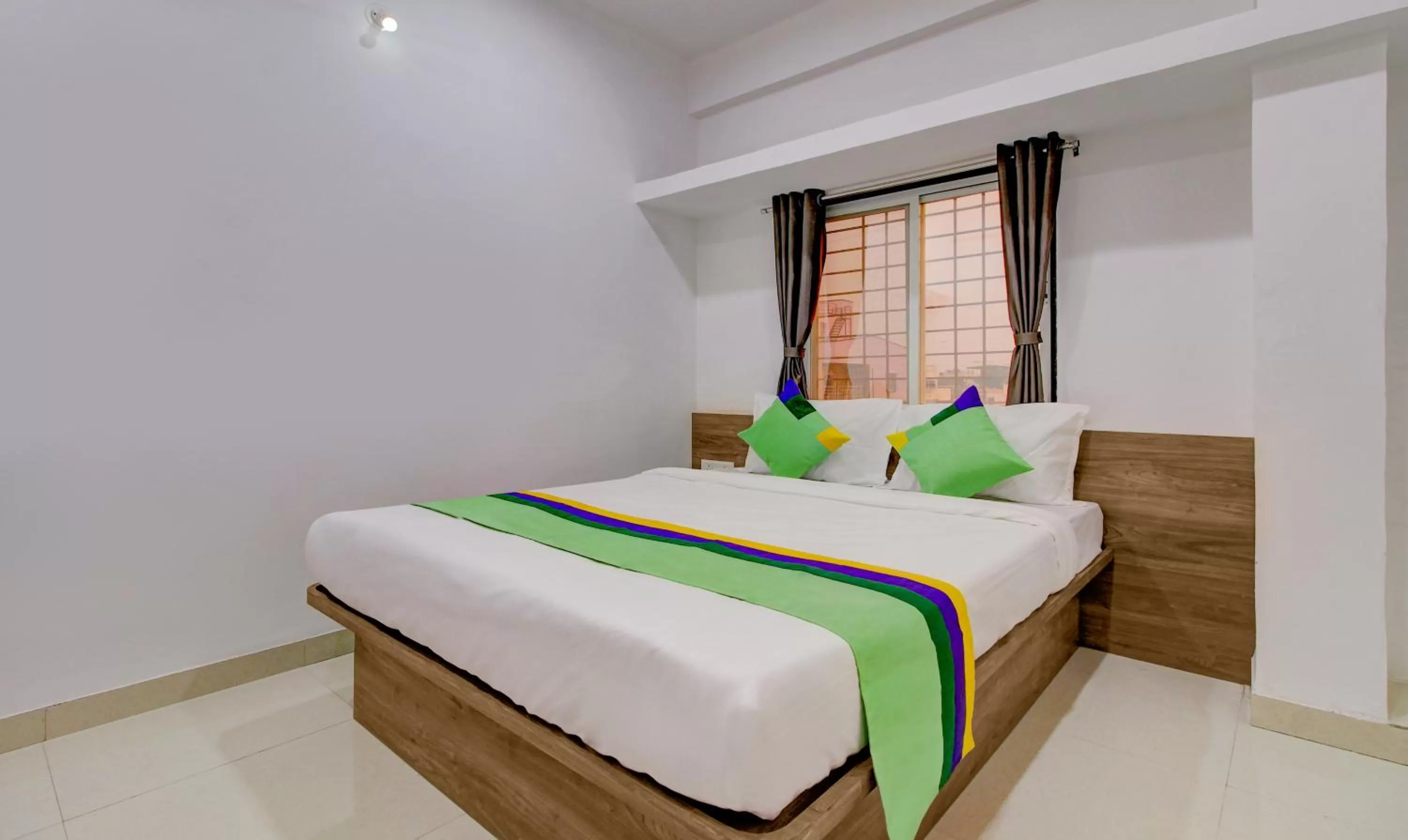 Bed in Treebo Trend White House