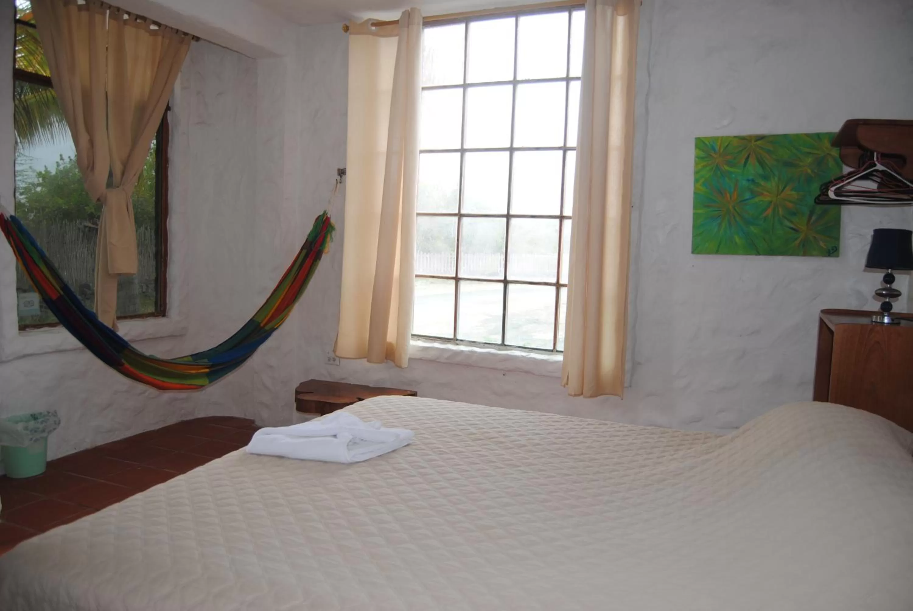 Bed in Hostal Galapagos by Bar de Beto