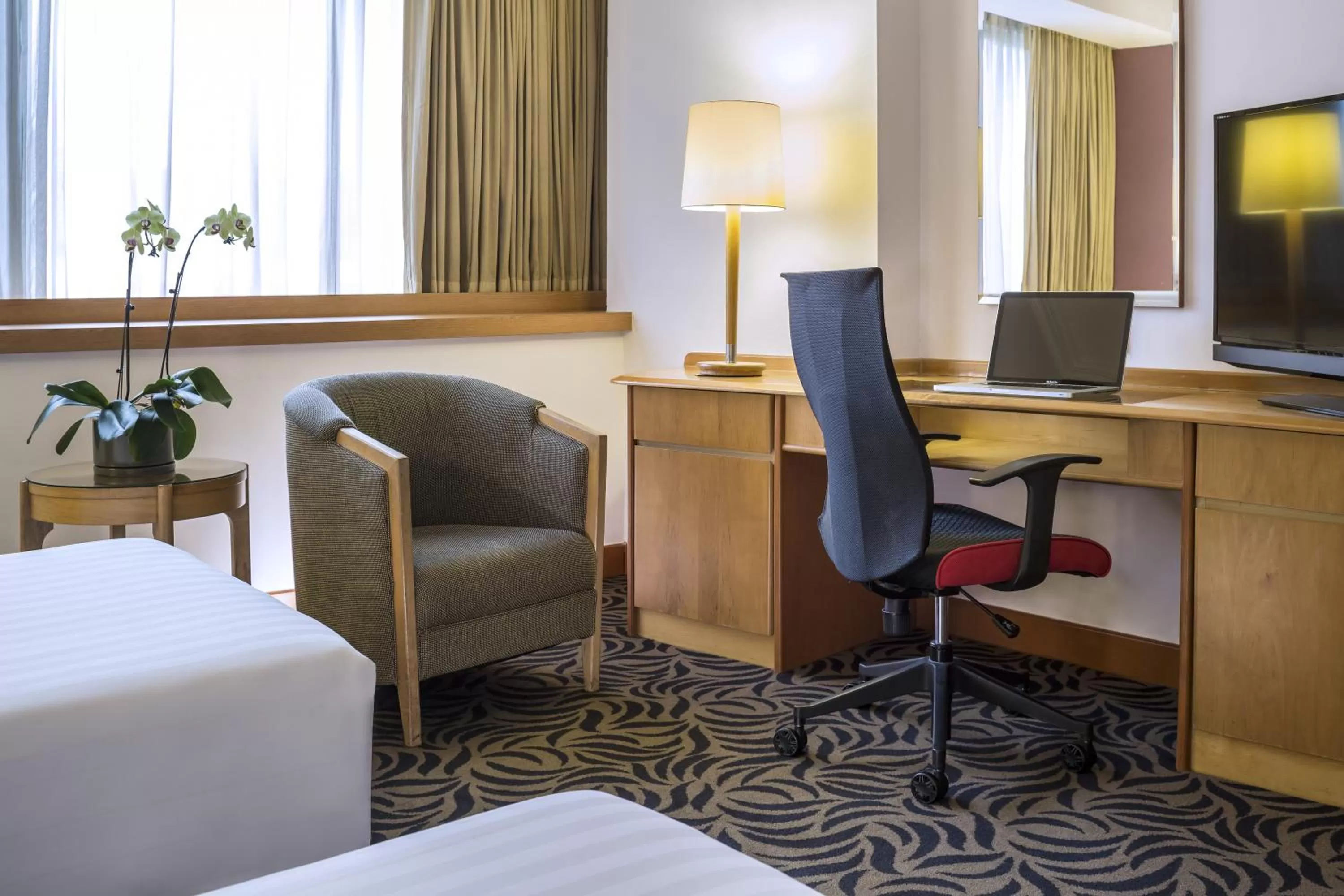 Seating area, Bed in Furama RiverFront