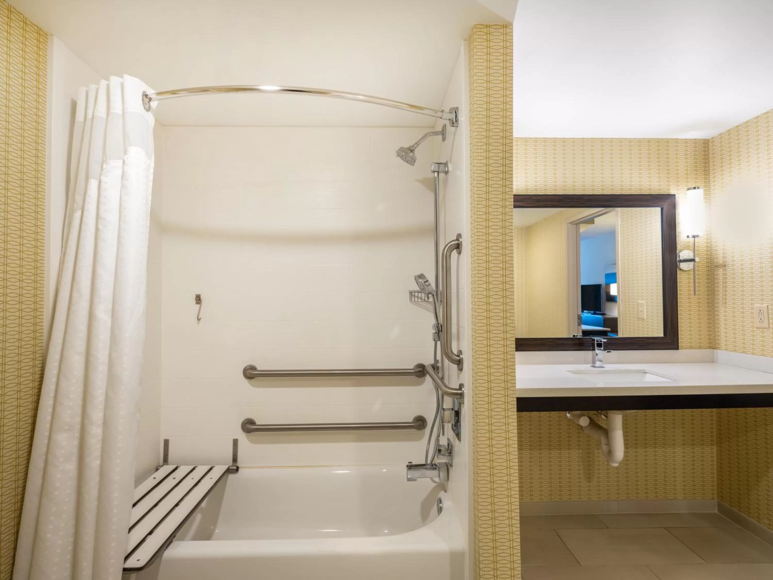 Bathroom in Holiday Inn Greensboro Coliseum by IHG
