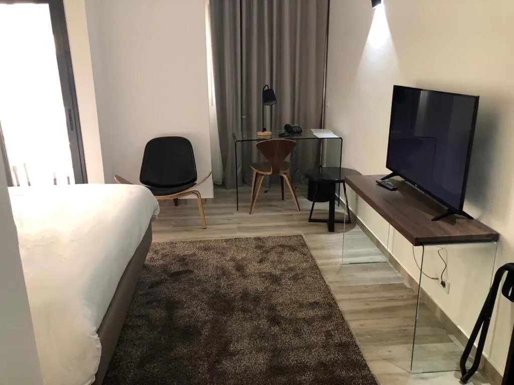 TV and multimedia, TV/Entertainment Center in Hotel L'Adresse Dakar