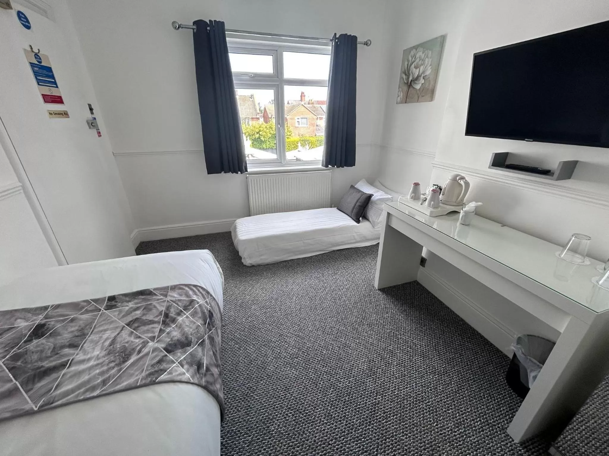 Bed in Charnwood Regency Guest House