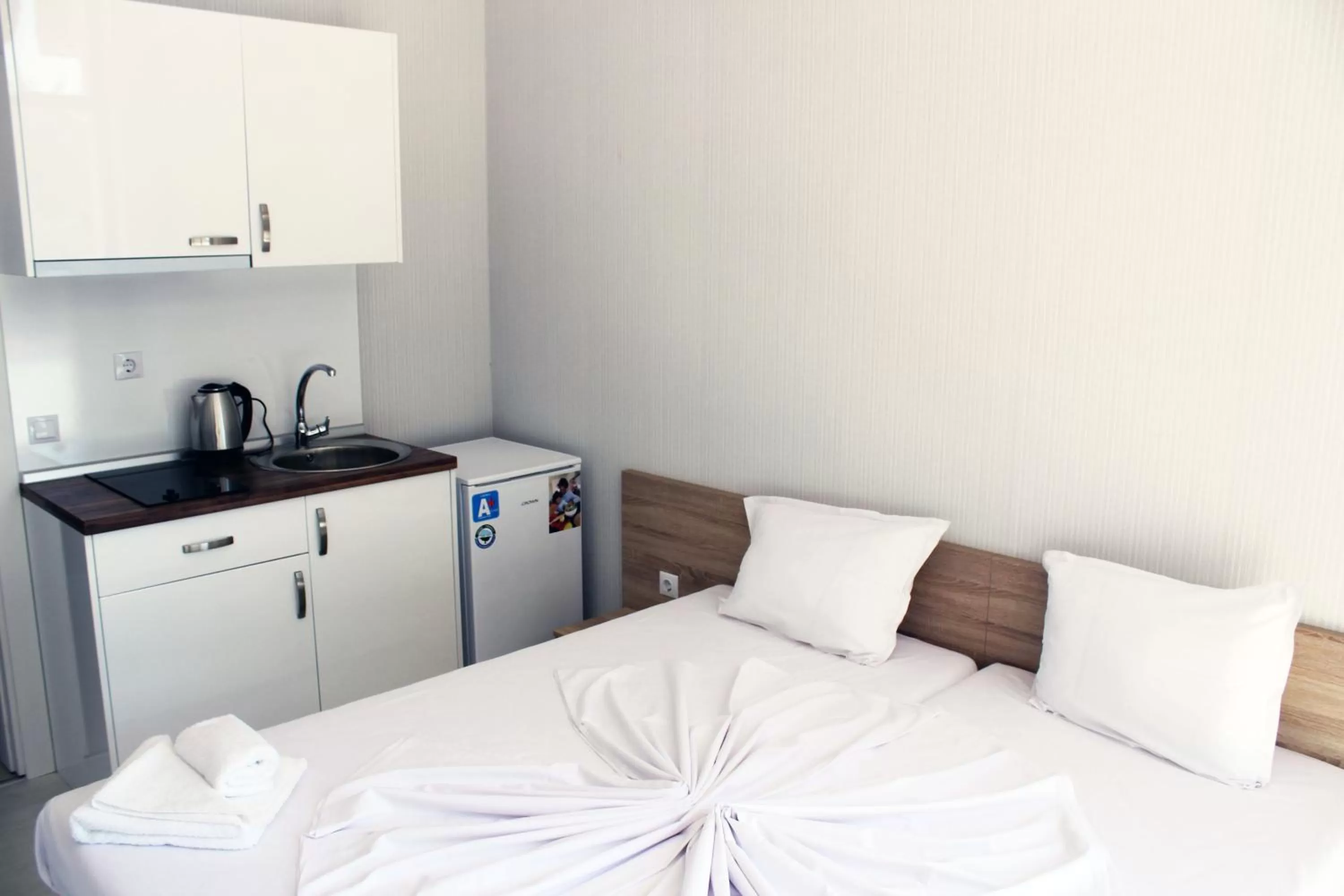 Bed in APART-HOTEL Stamopolu Lux с изглед към морето