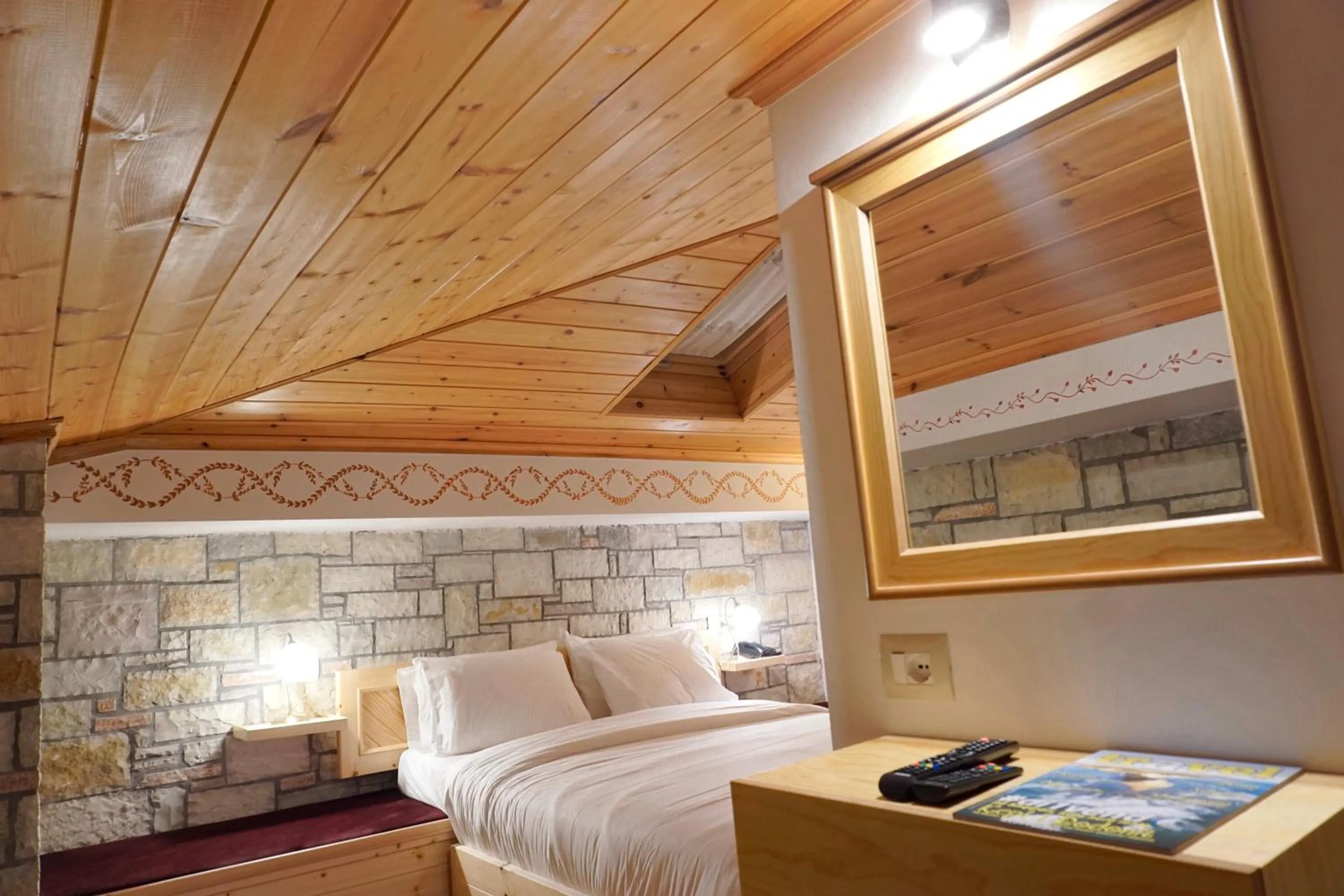 Bed in Hotel Argjiro