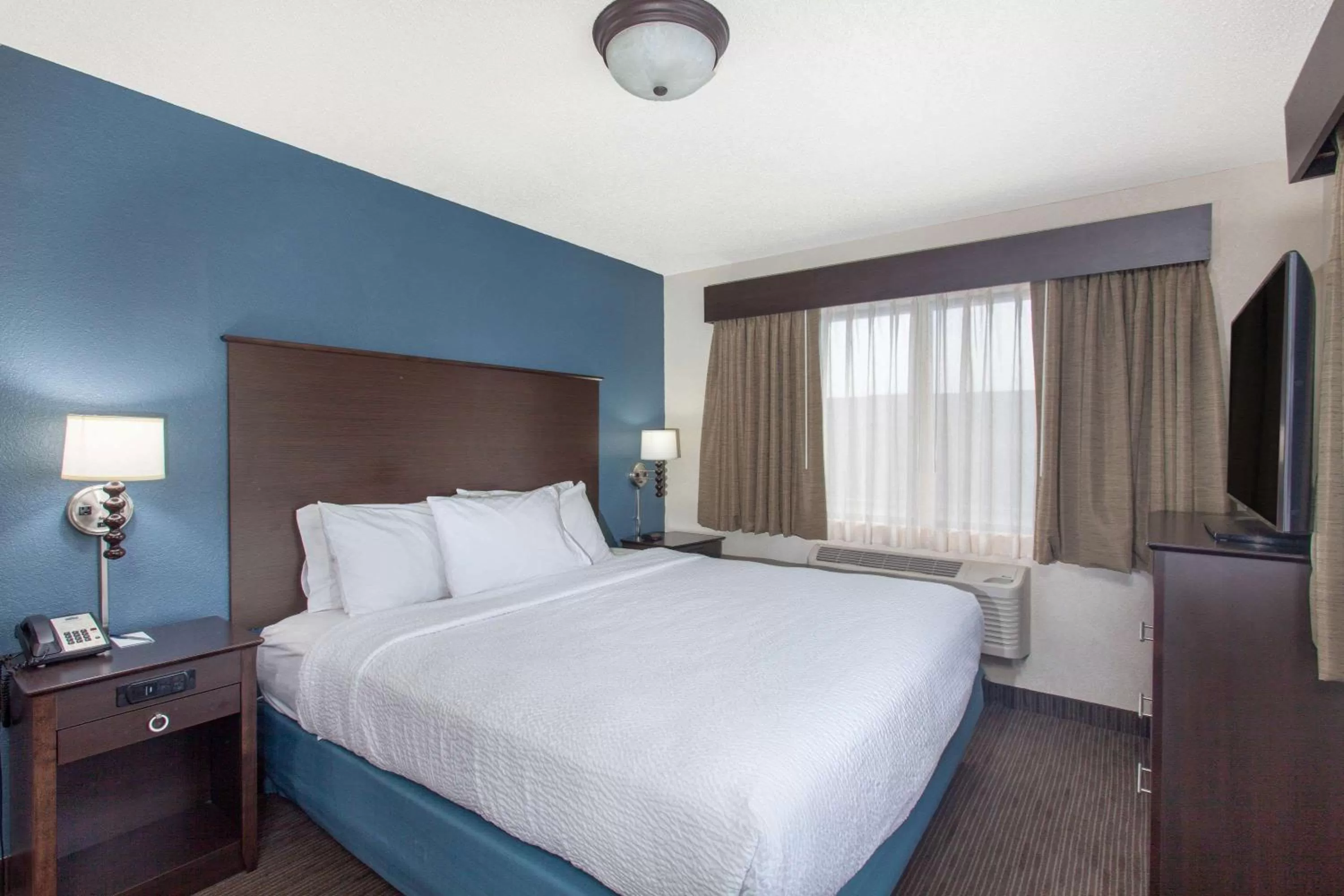 Photo of the whole room, Bed in AmericInn by Wyndham Mankato Event Center near MSU