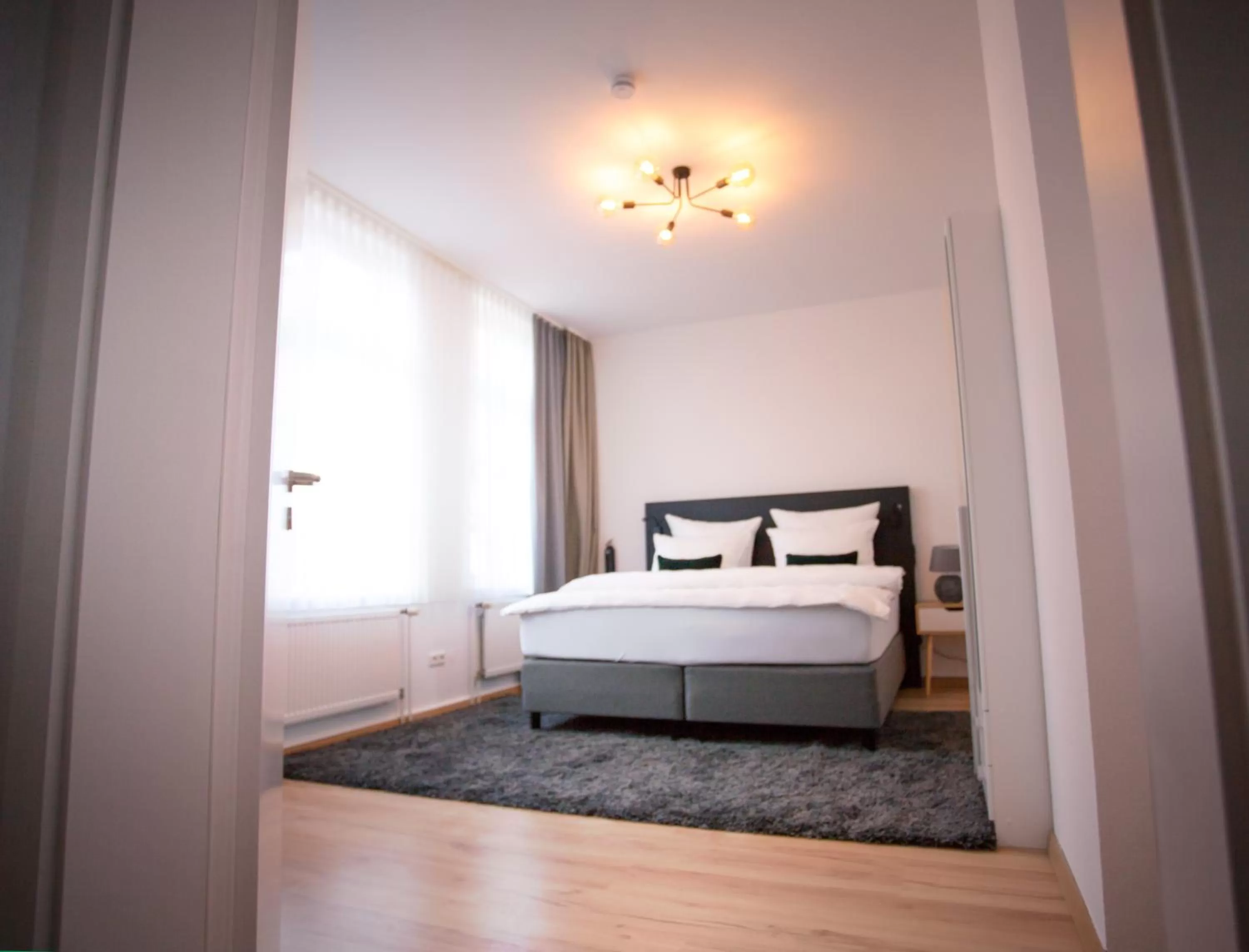 Bed in ONNO Boutique Hotel & Apartments