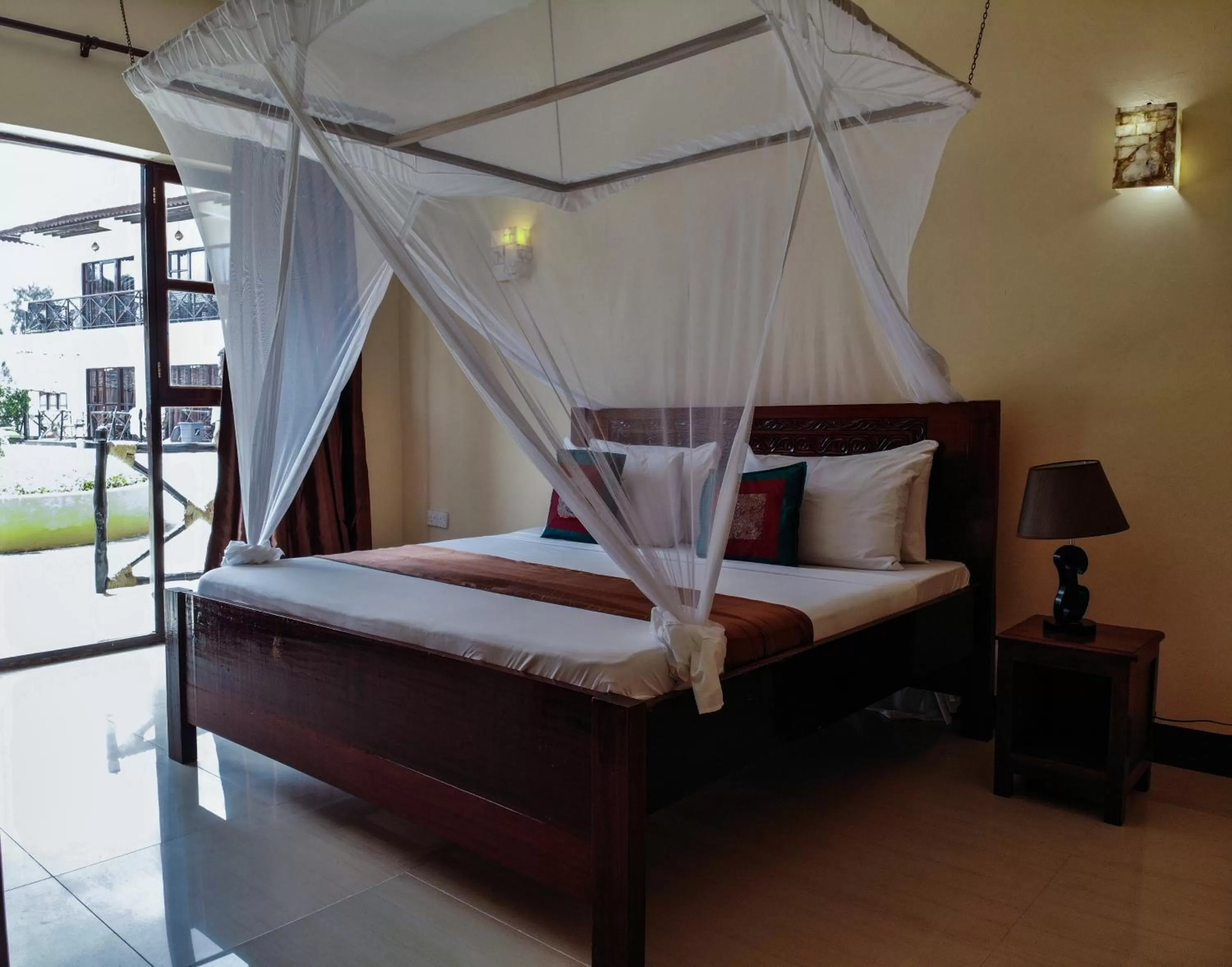 Bed in Amaan Beach Bungalows