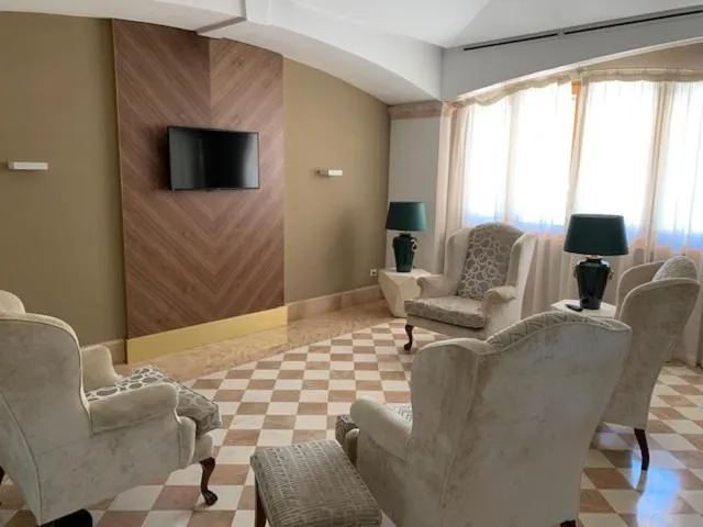 Communal lounge/ TV room in Relais La Fattoria