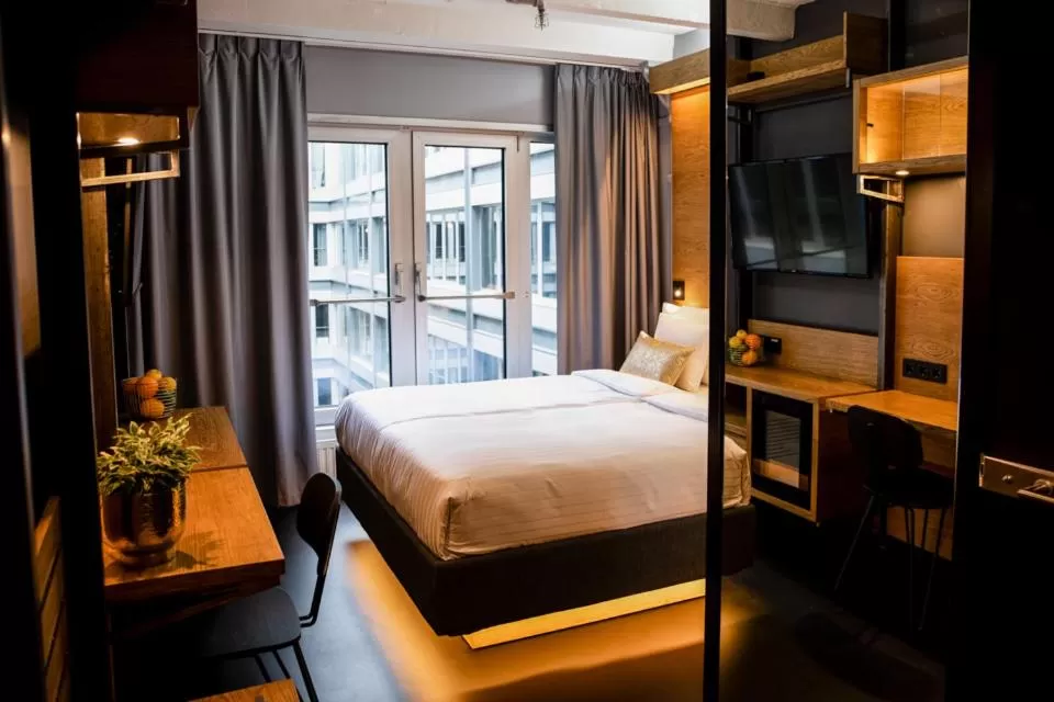 Photo of the whole room, Bed in GINN Hotel Hamburg Elbspeicher