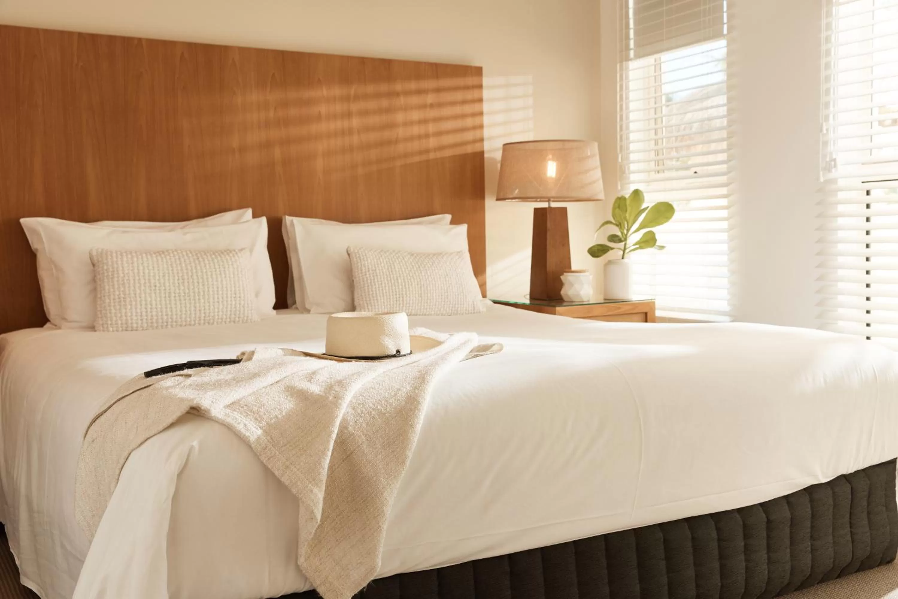 Bed in Sea Change Beachfront Apartments