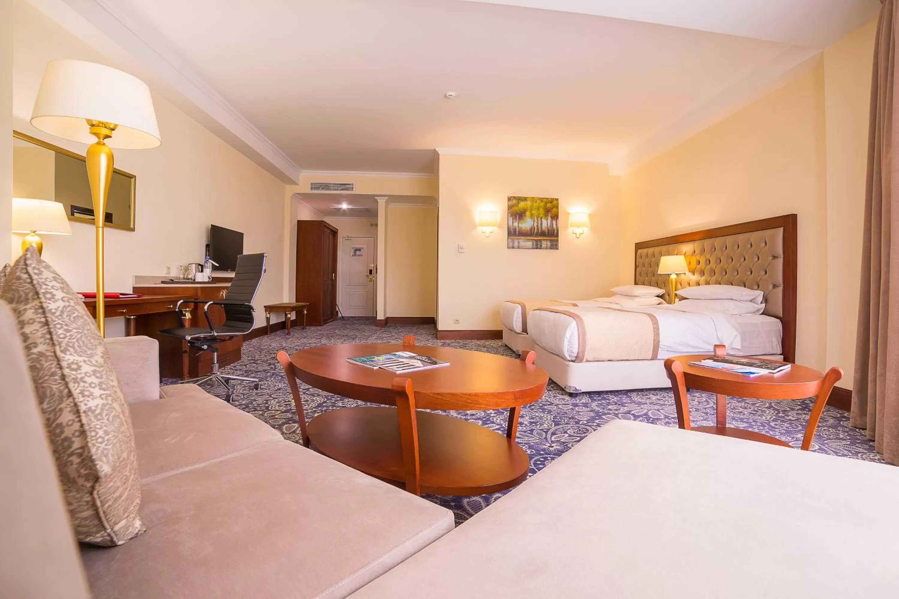 Bedroom in Ramada by Wyndham Almaty