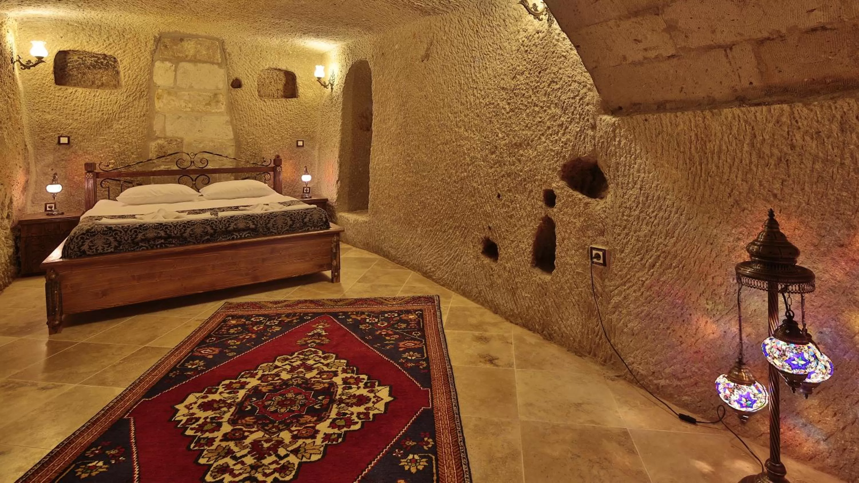 Living room, Bed in Cappadocia Cave Land Hotel