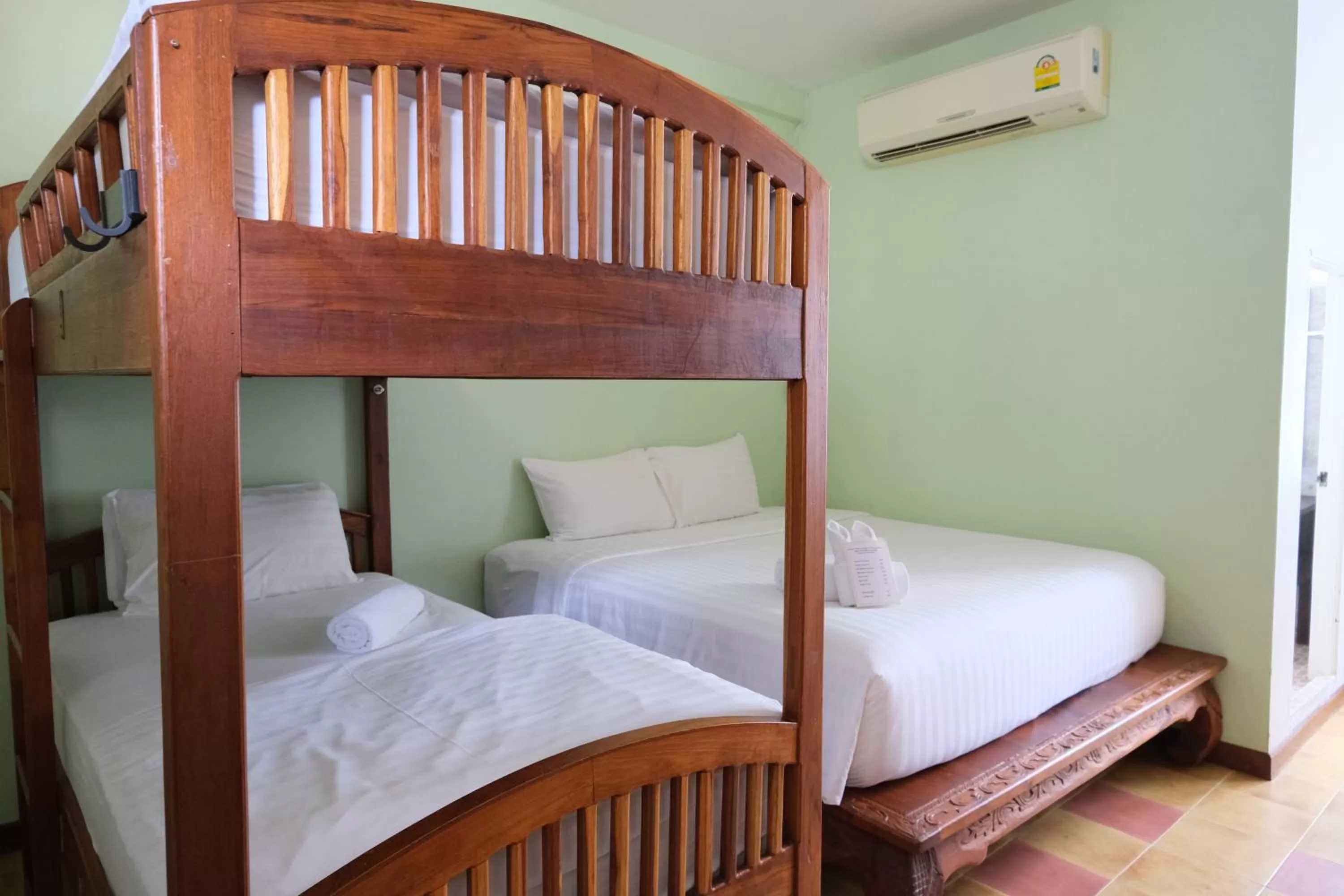 Bed in Feung Nakorn Balcony Rooms and Cafe