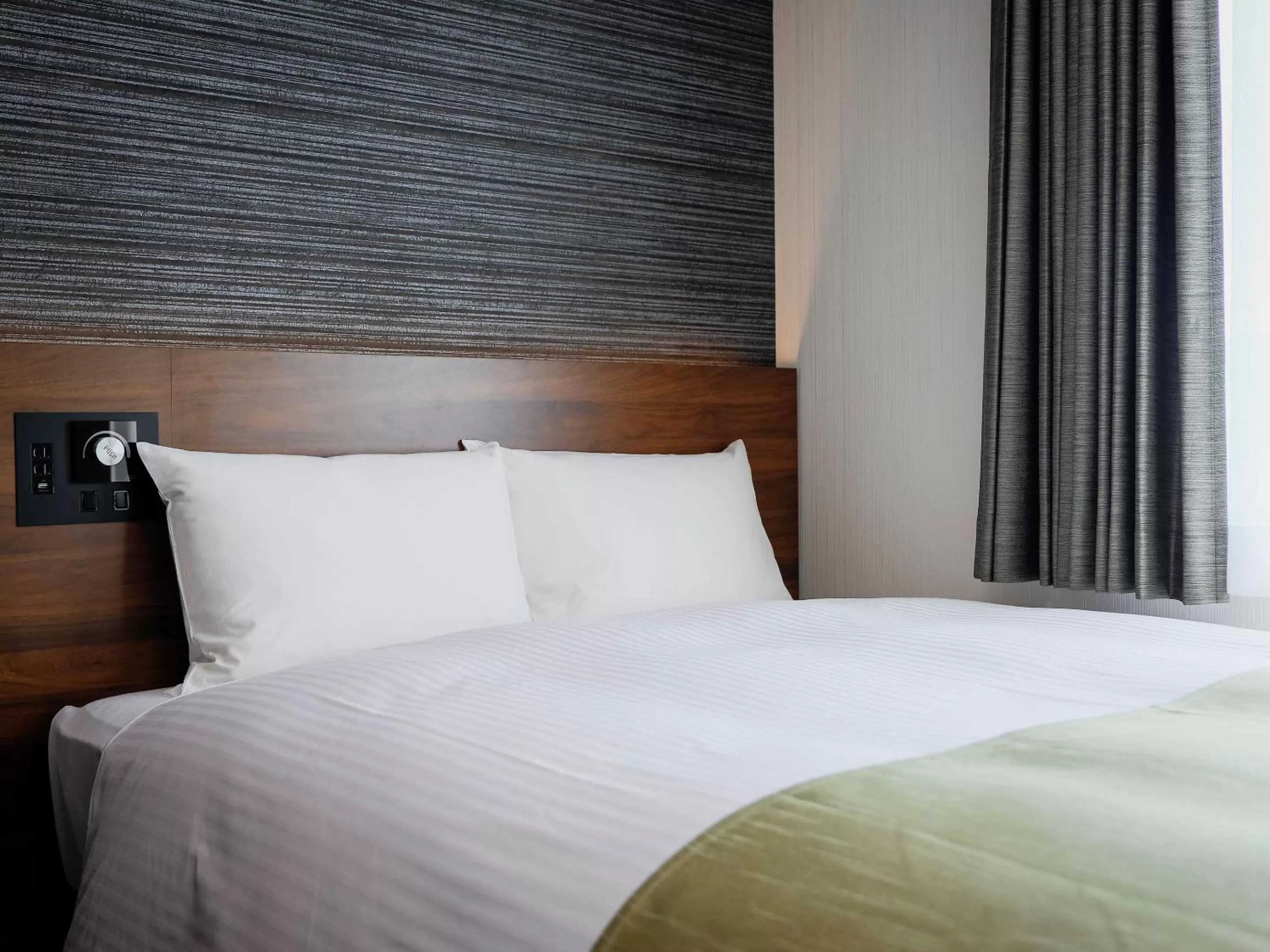 Bed in KOKO HOTEL Takamatsu - formerly Hotel Wing Takamatsu