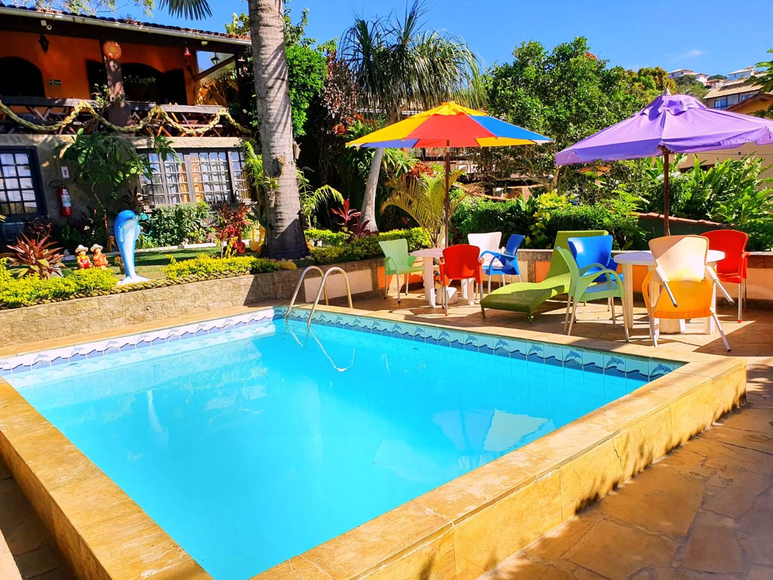 Swimming pool in Suítes Casa do Barão