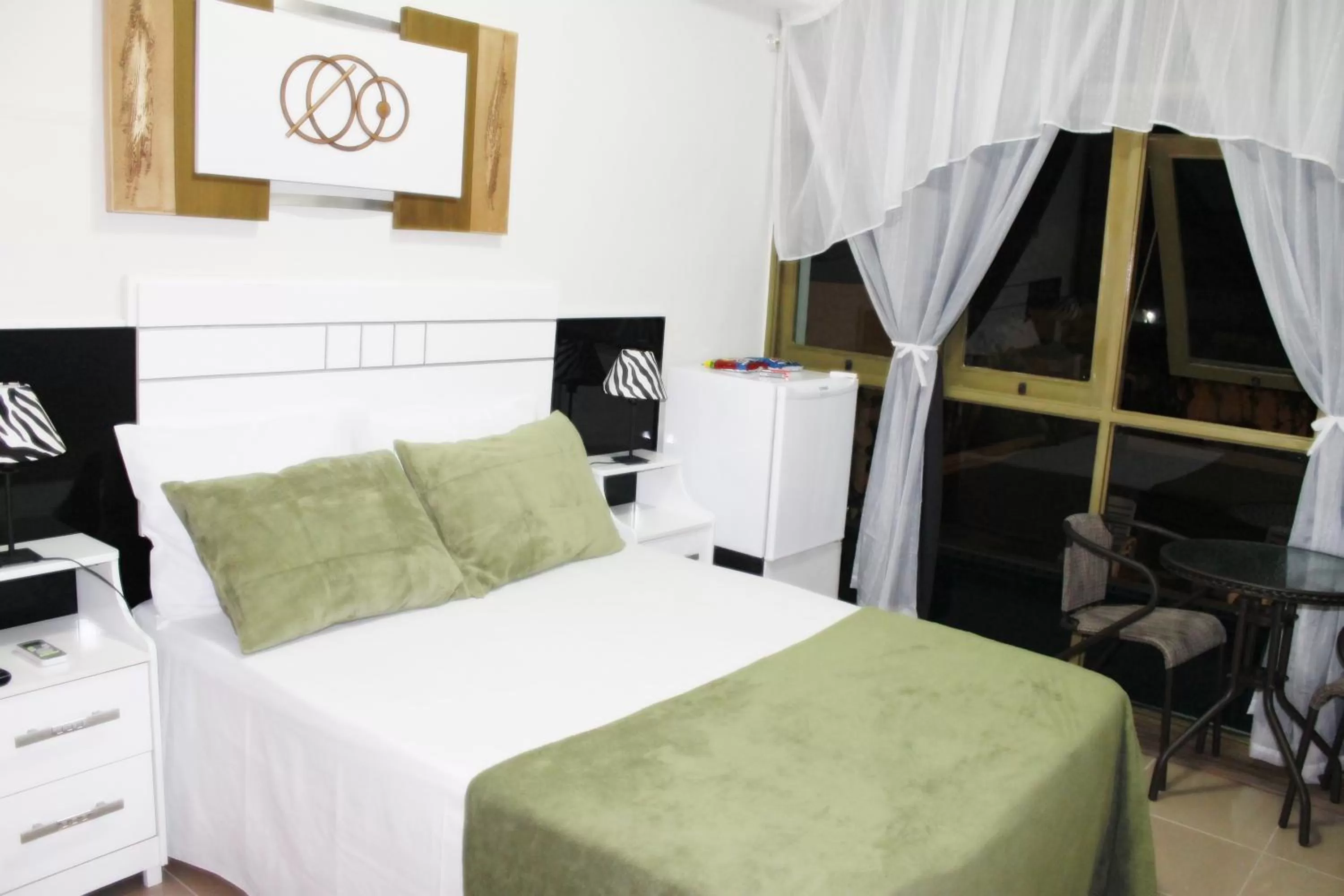 Bed in Pousada Das Palmeiras