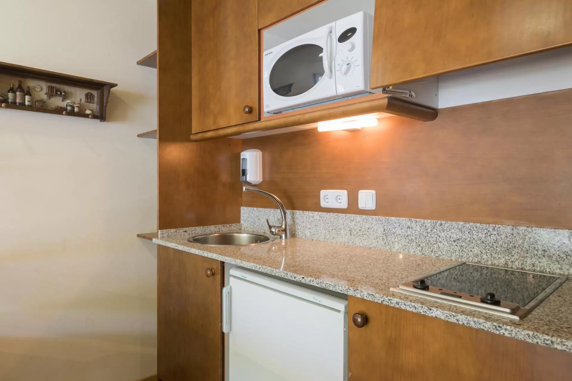 Kitchen or kitchenette in Aparthotel La Vall Blanca