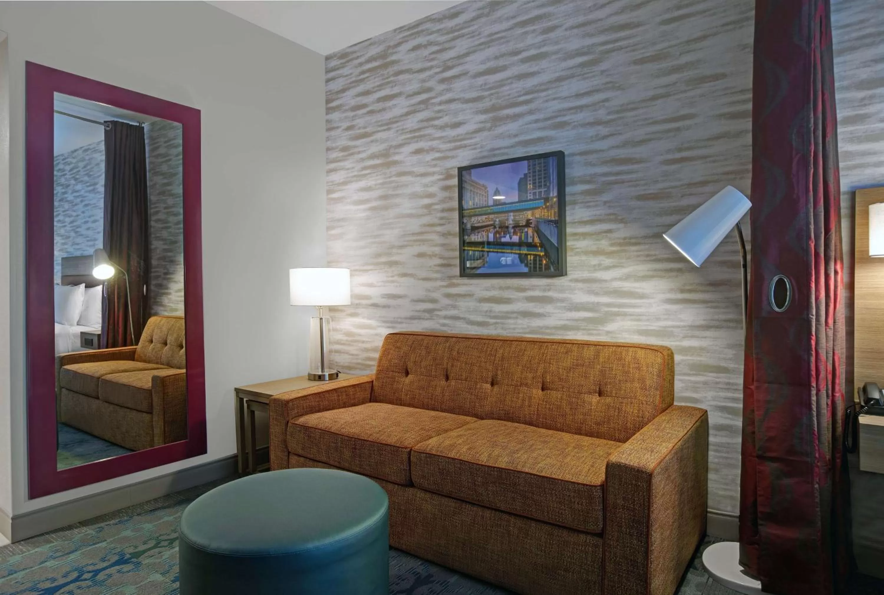 Living room, Bed in Home2 Suites By Hilton Milwaukee Downtown