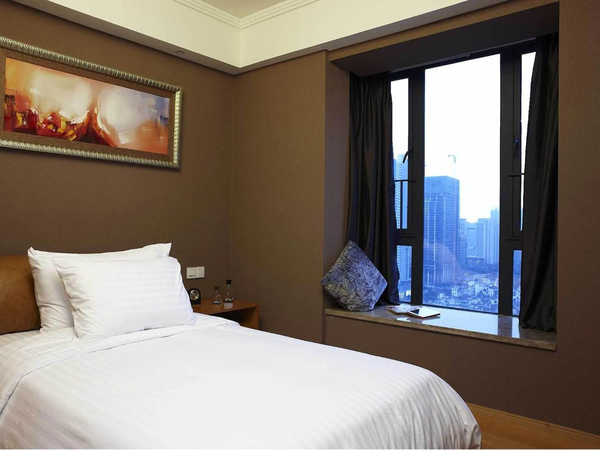 Bed in 广州丹顿行政公寓-Dan Executive Apartment Guangzhou Zhujiang New Town