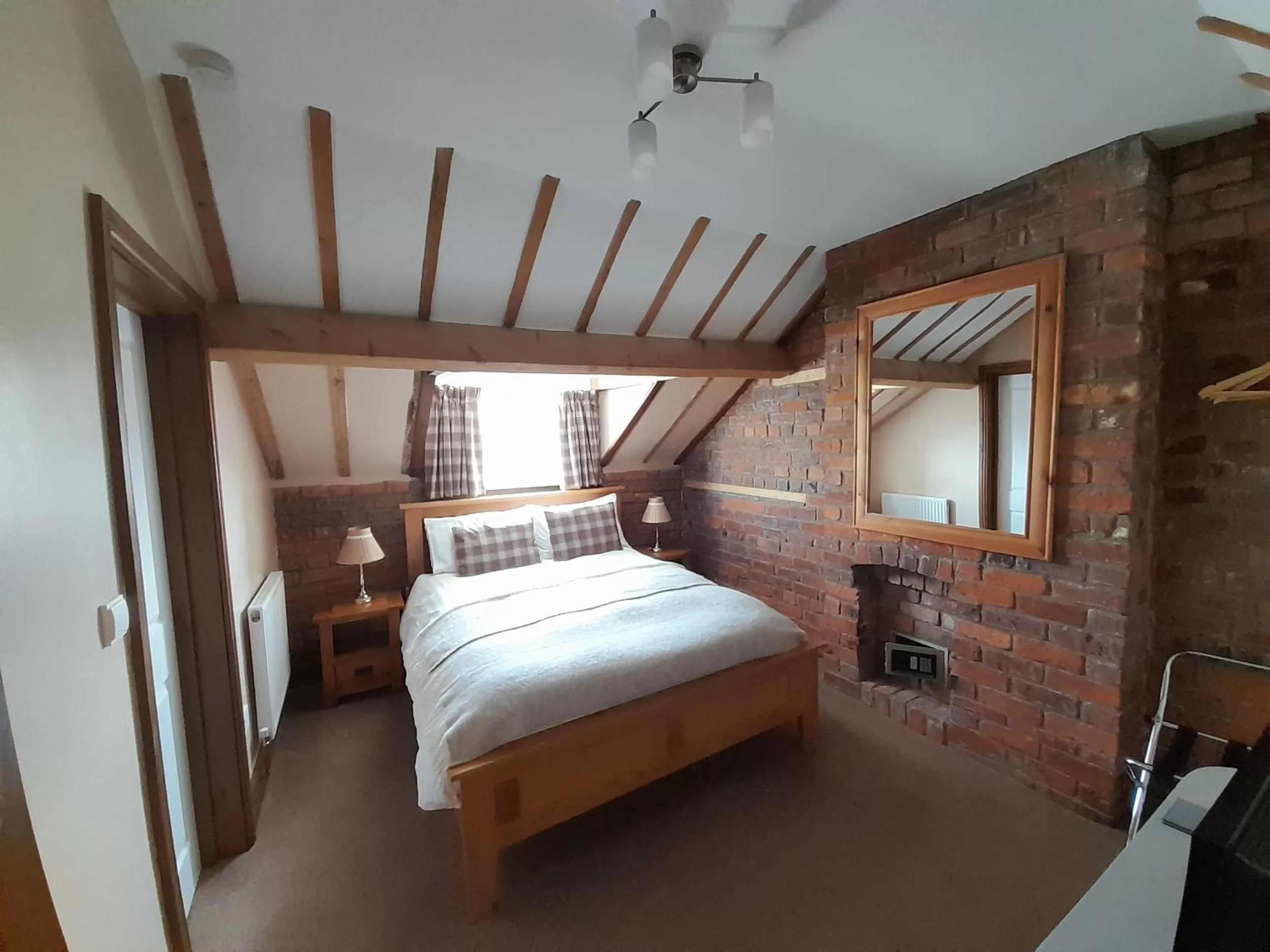 Bed in The Dolfor Inn