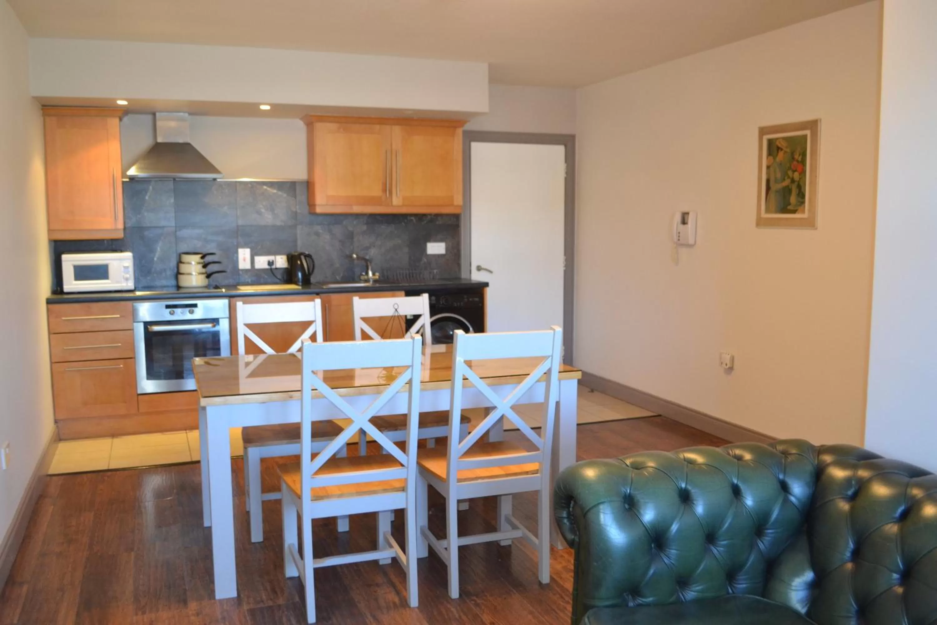 Kitchen or kitchenette in Walsh's Hotel and Apartments