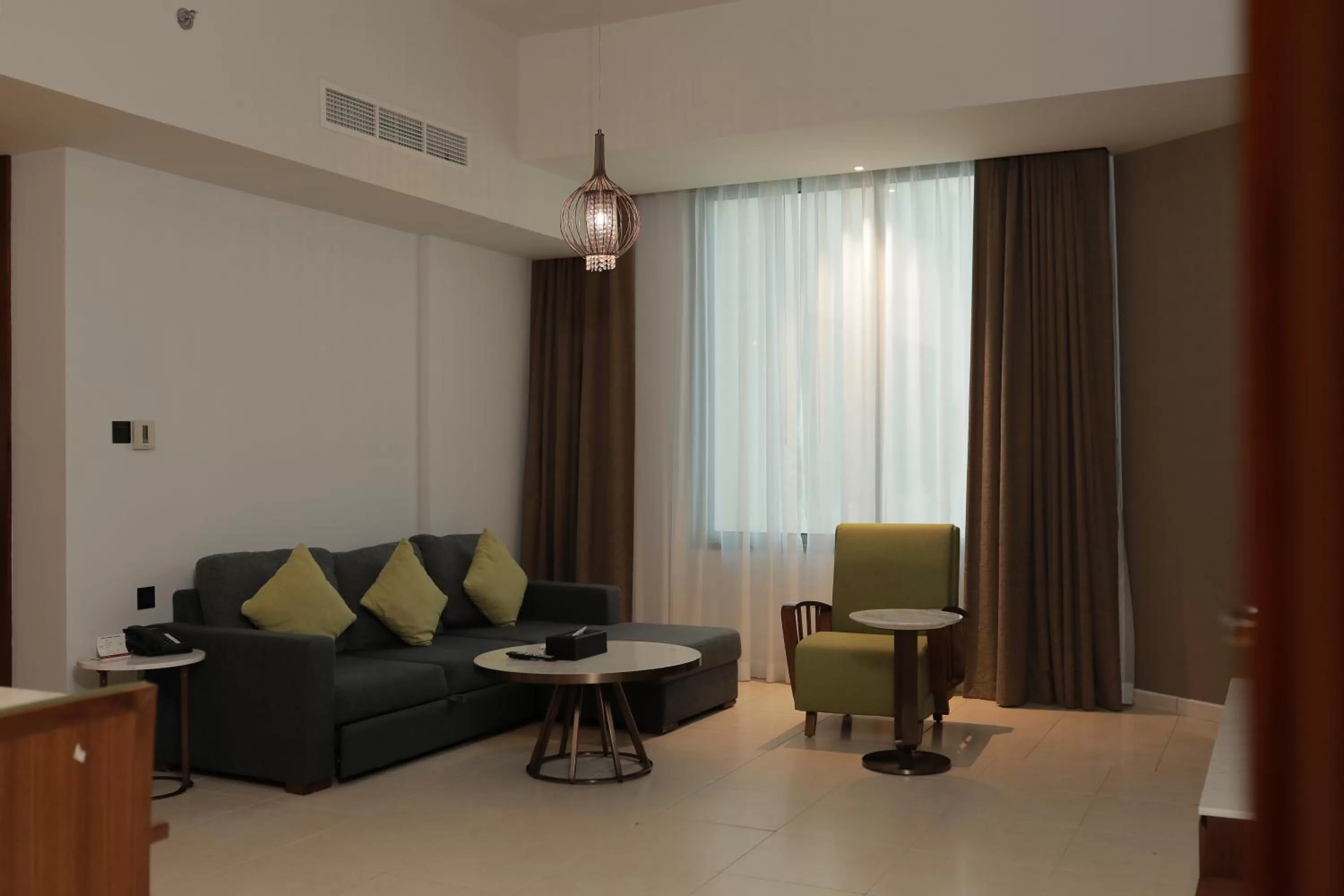 Living room in Ramee Palace Hotel