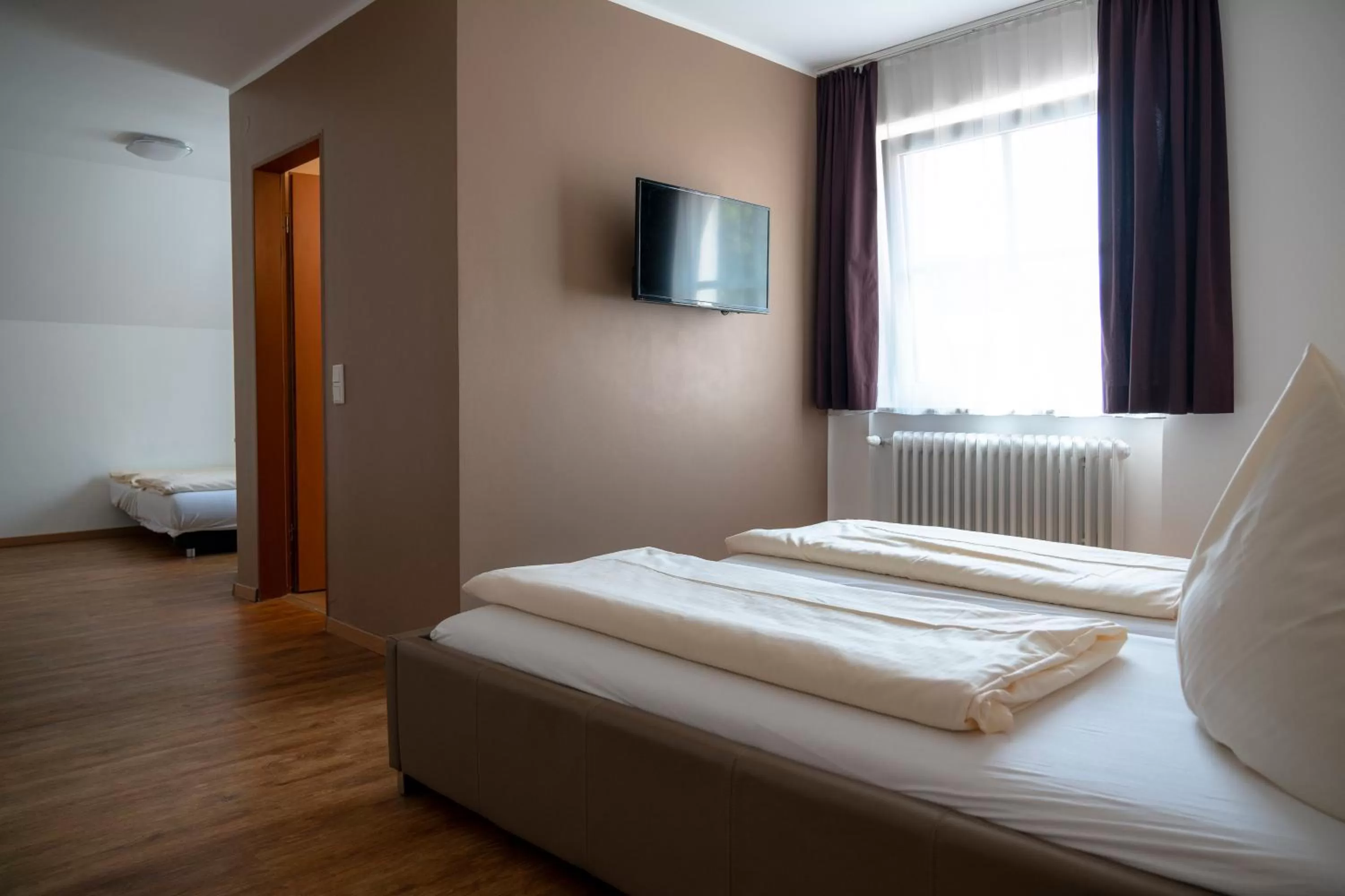 Photo of the whole room, Bed in Landgasthof Mörsbergei